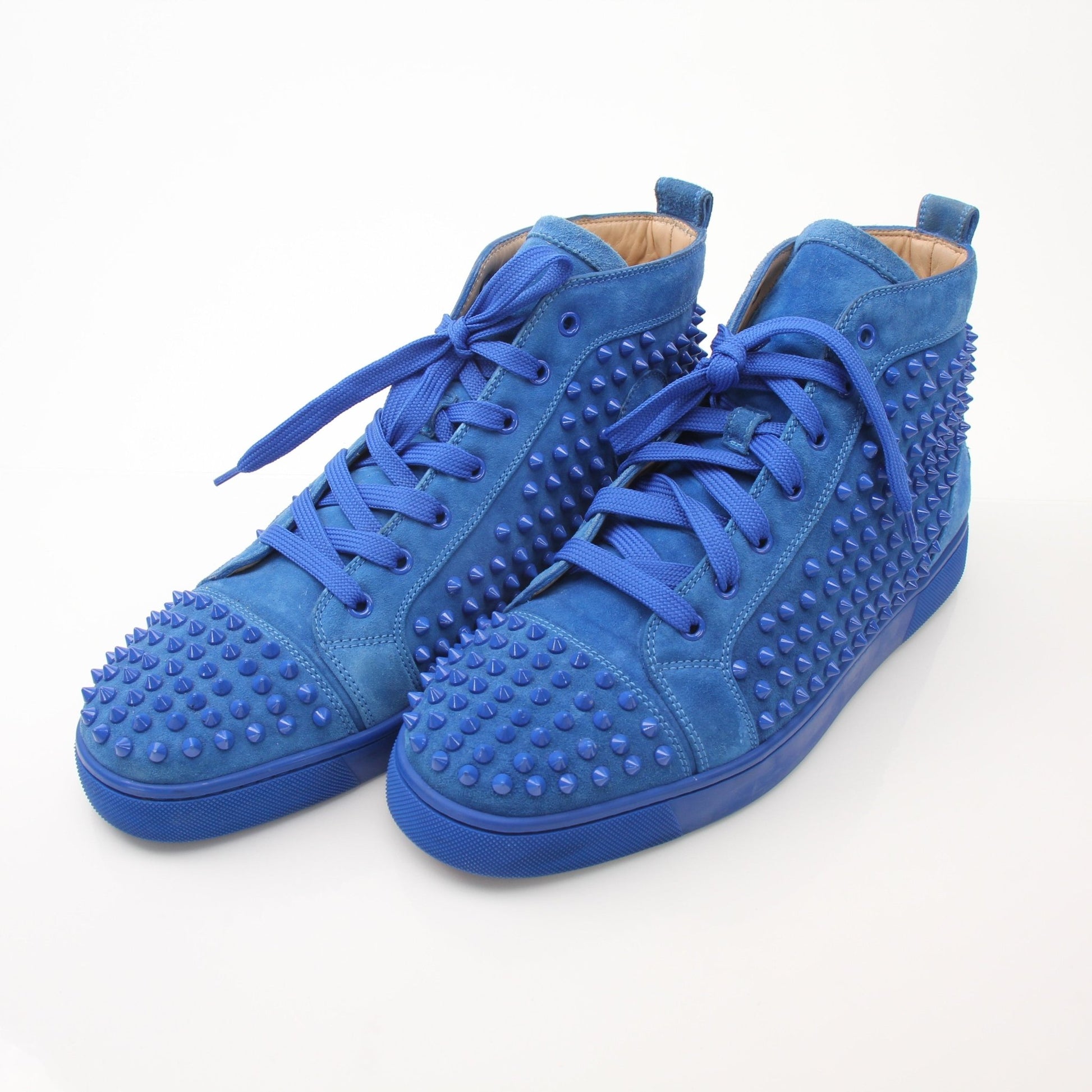 Christian Louboutin men's Louis flat high top sneakers in black leather with red soles and gold accents.