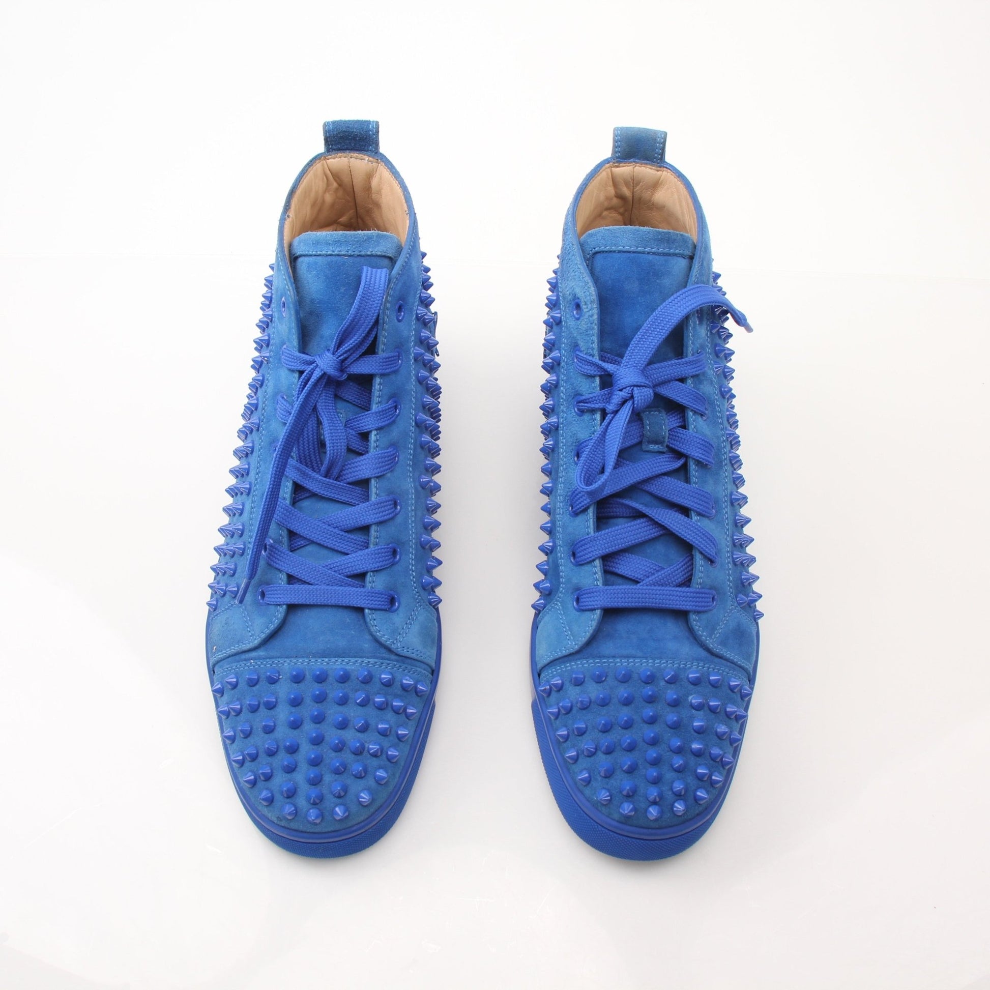 Christian Louboutin men's Louis flat high top sneakers in black with signature red soles, stylishly displayed on a white background.