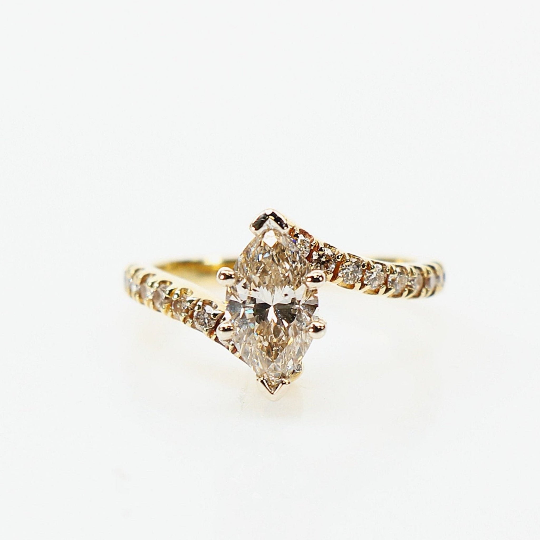 10K yellow gold diamond ring from Gold & Beyond featuring a refined design with sparkling diamonds.