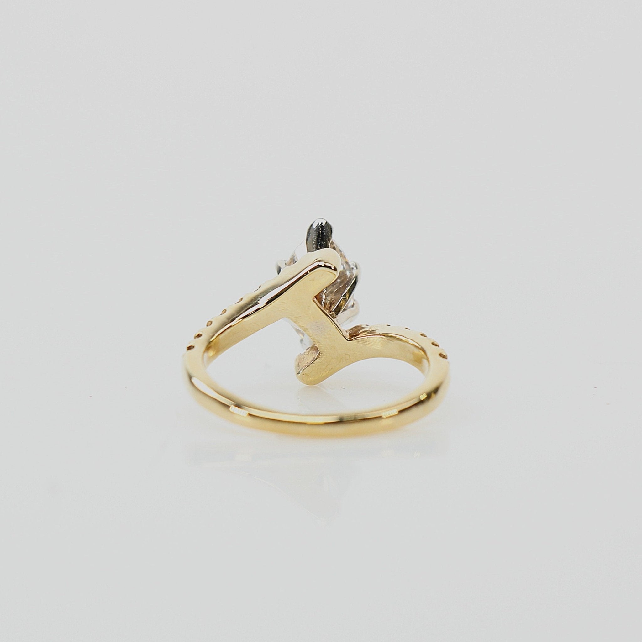 10K yellow gold diamond ring with intricate design, showcasing sparkling diamonds and elegant craftsmanship by Gold & Beyond.