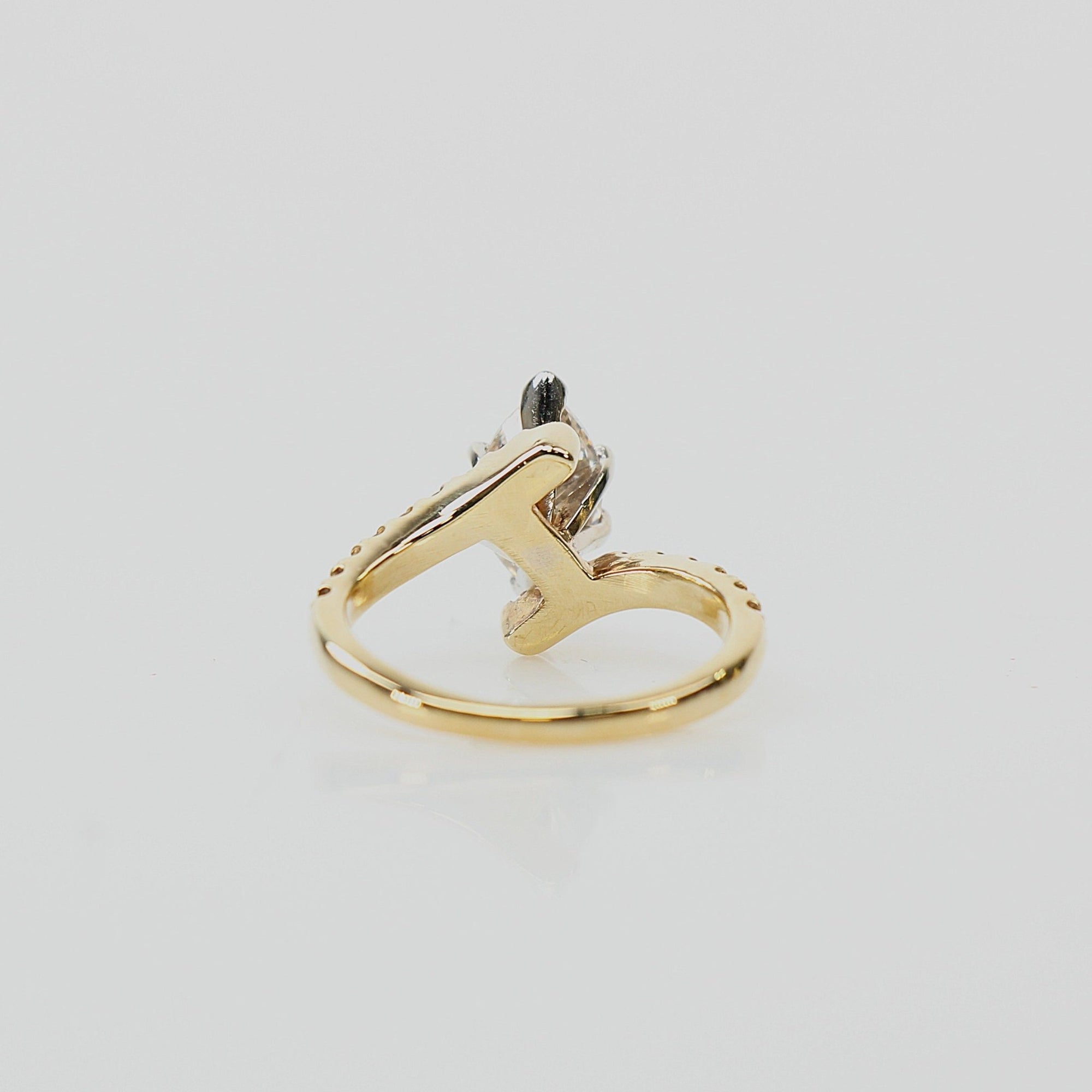 10K yellow gold diamond ring with intricate design, showcasing sparkling diamonds and elegant craftsmanship by Gold &amp; Beyond.