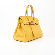 Hermès Birkin 30 yellow handbag by Gold & Beyond, featuring smooth leather and gold hardware, displayed on a neutral background.
