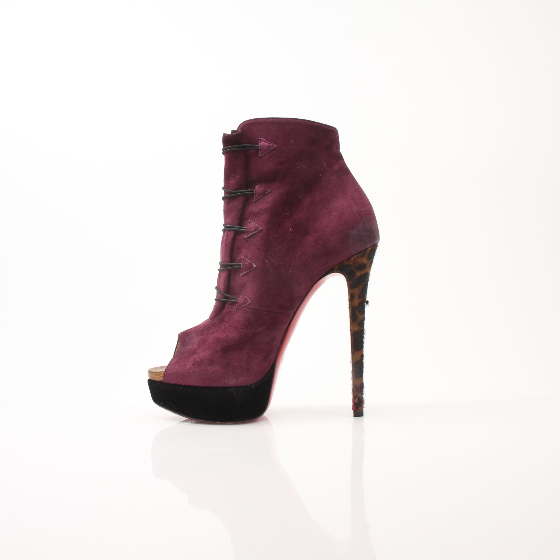 Christian Louboutin Women's Lady Booton 140 ankle boots featuring sleek design and signature red soles.