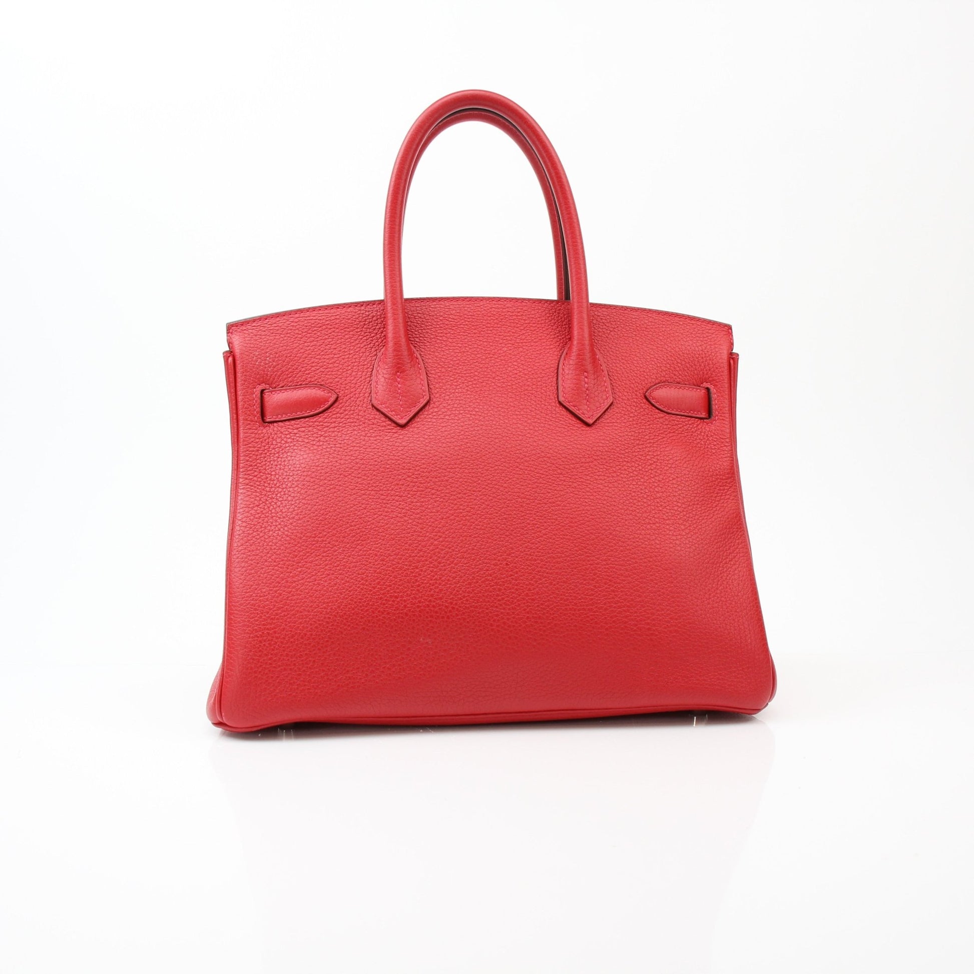 Hermès Birkin 30 Geranium handbag in vibrant red leather with gold hardware, displayed on a neutral background.
