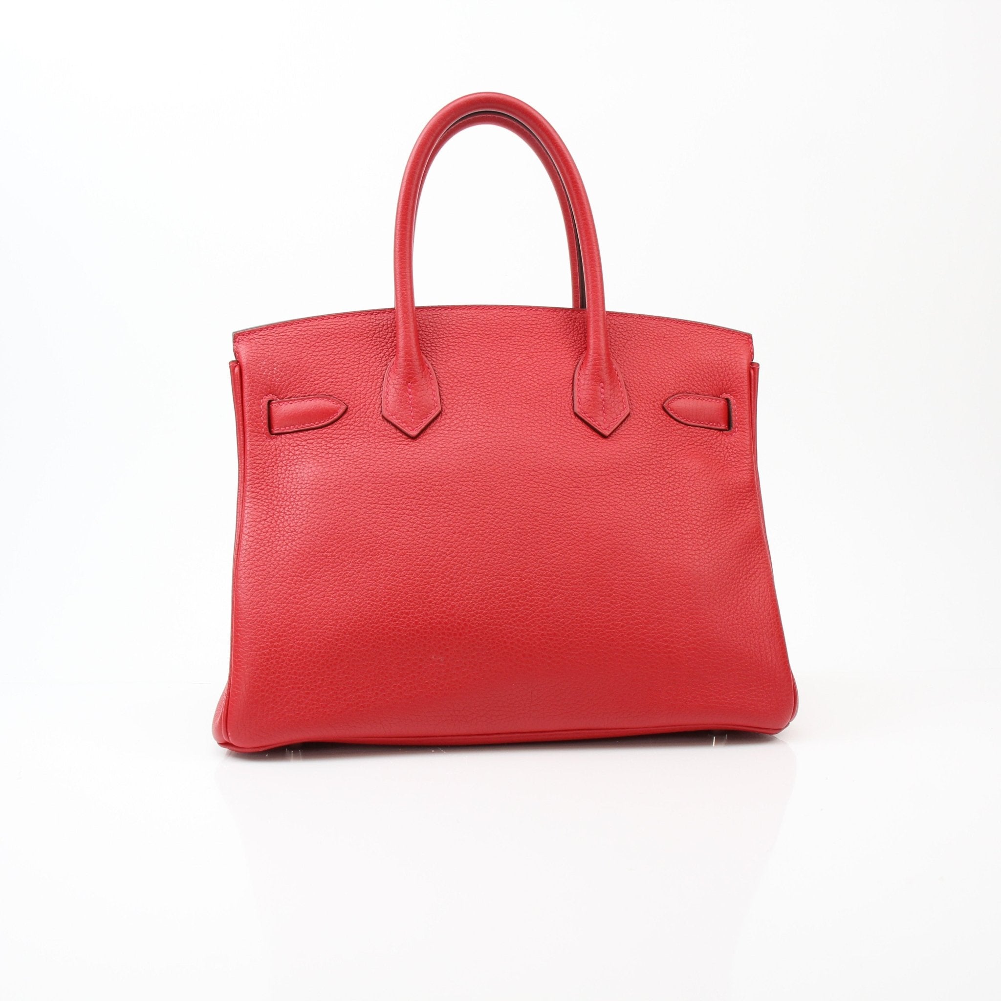 Hermès Birkin 30 Geranium handbag in vibrant red leather with gold hardware, displayed on a neutral background.
