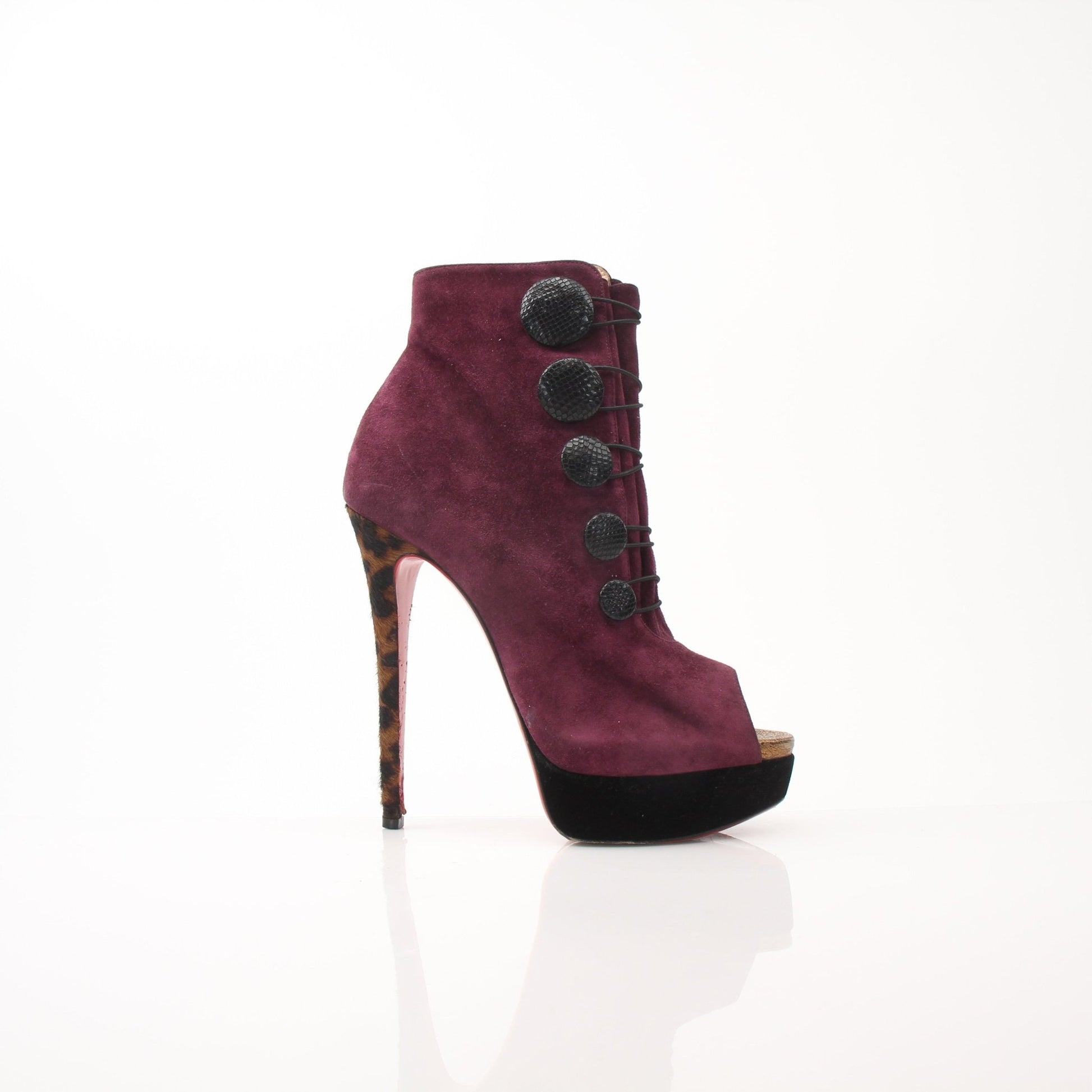 Gold & Beyond Christian Louboutin women's Lady Booton 140 ankle boots, stylish black shoes with pointed toe and high heel.