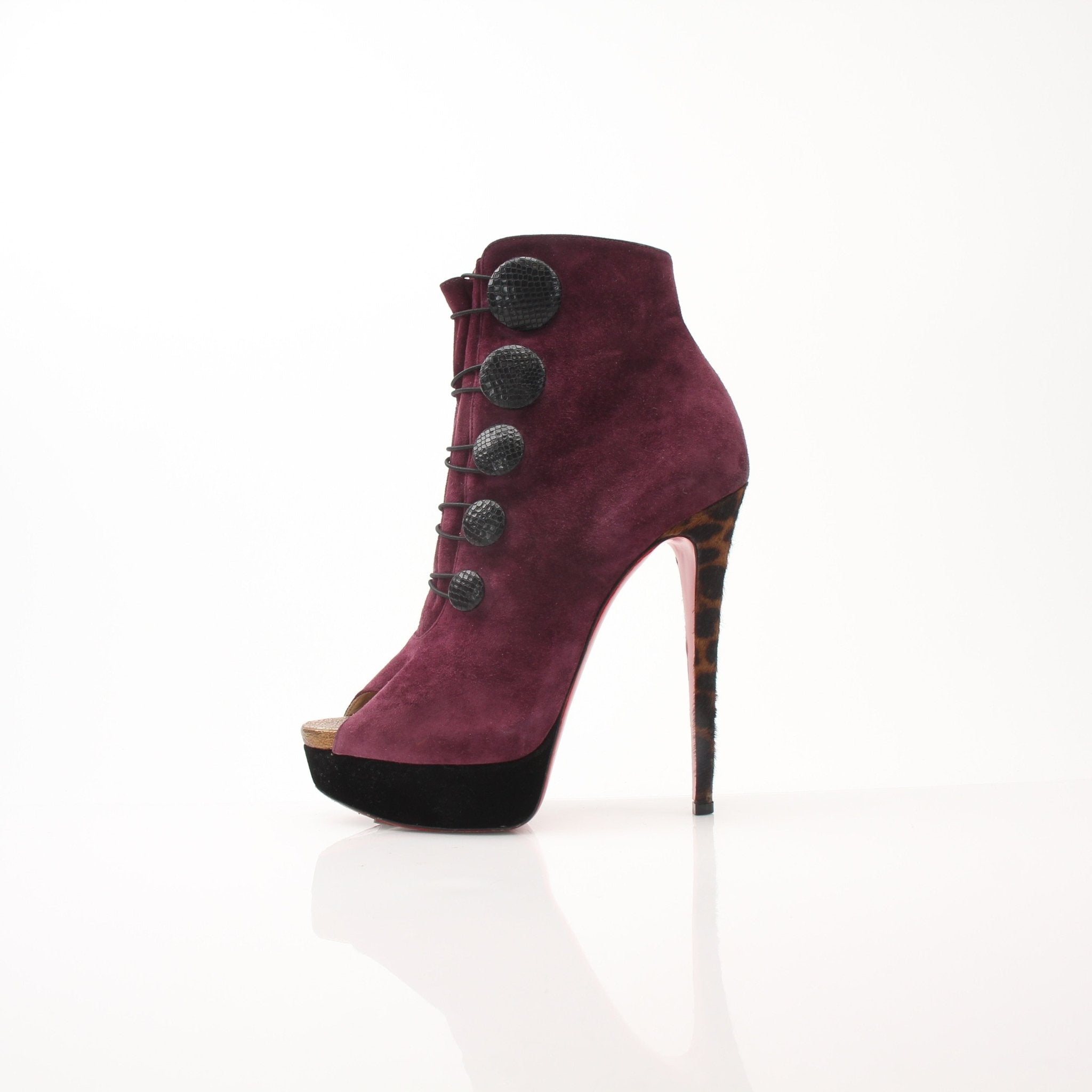 Gold & Beyond Christian Louboutin women's Lady Booton 140 ankle boots with sleek design and iconic red sole.