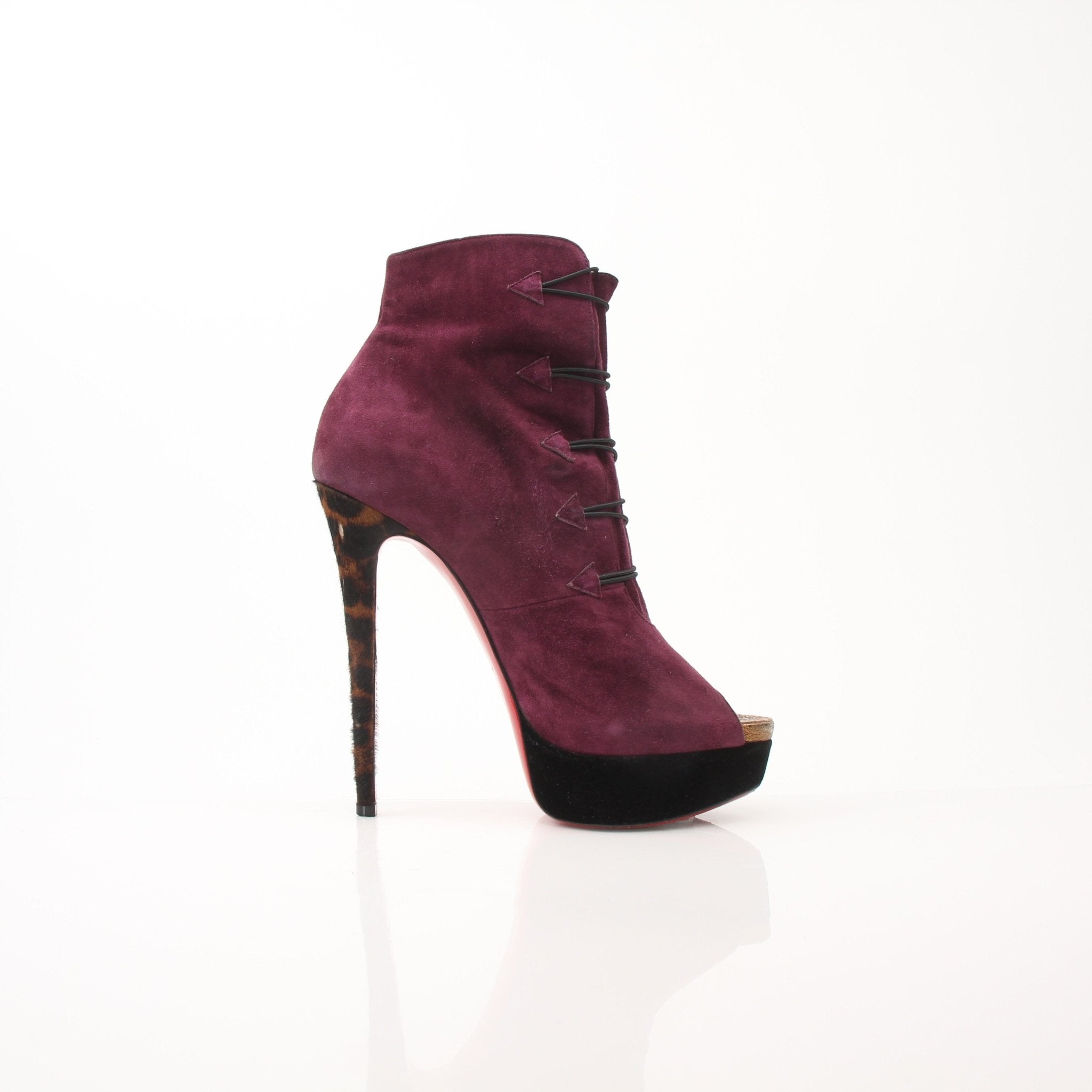 Christian Louboutin women's Lady Booton 140 ankle boots, black leather shoes with pointed toes and signature red soles.