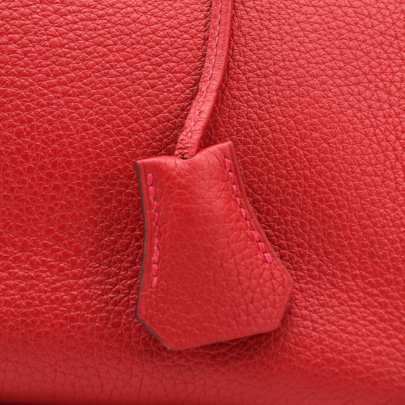 Hermès Birkin 30 Geranium handbag with gold hardware, showcasing luxurious leather and elegant design.