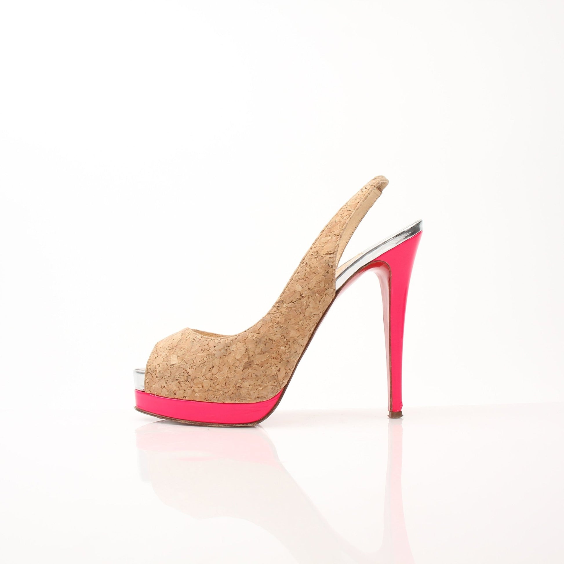 Christian Louboutin Catenita cork platform slingback heels with red soles, featuring elegant straps and signature style.