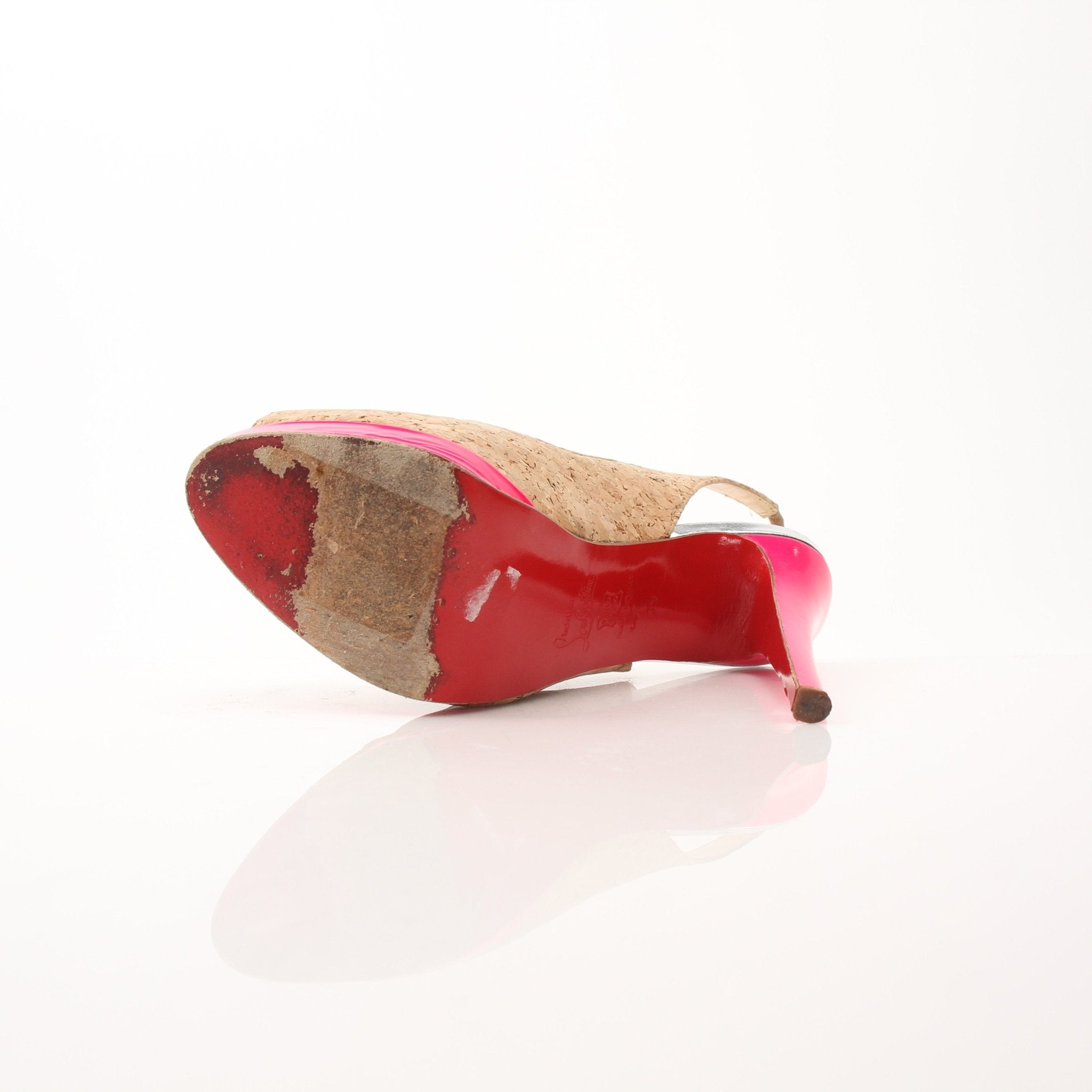 Christian Louboutin Catenita cork platform slingback heels with red soles and elegant design, displayed on a neutral background.