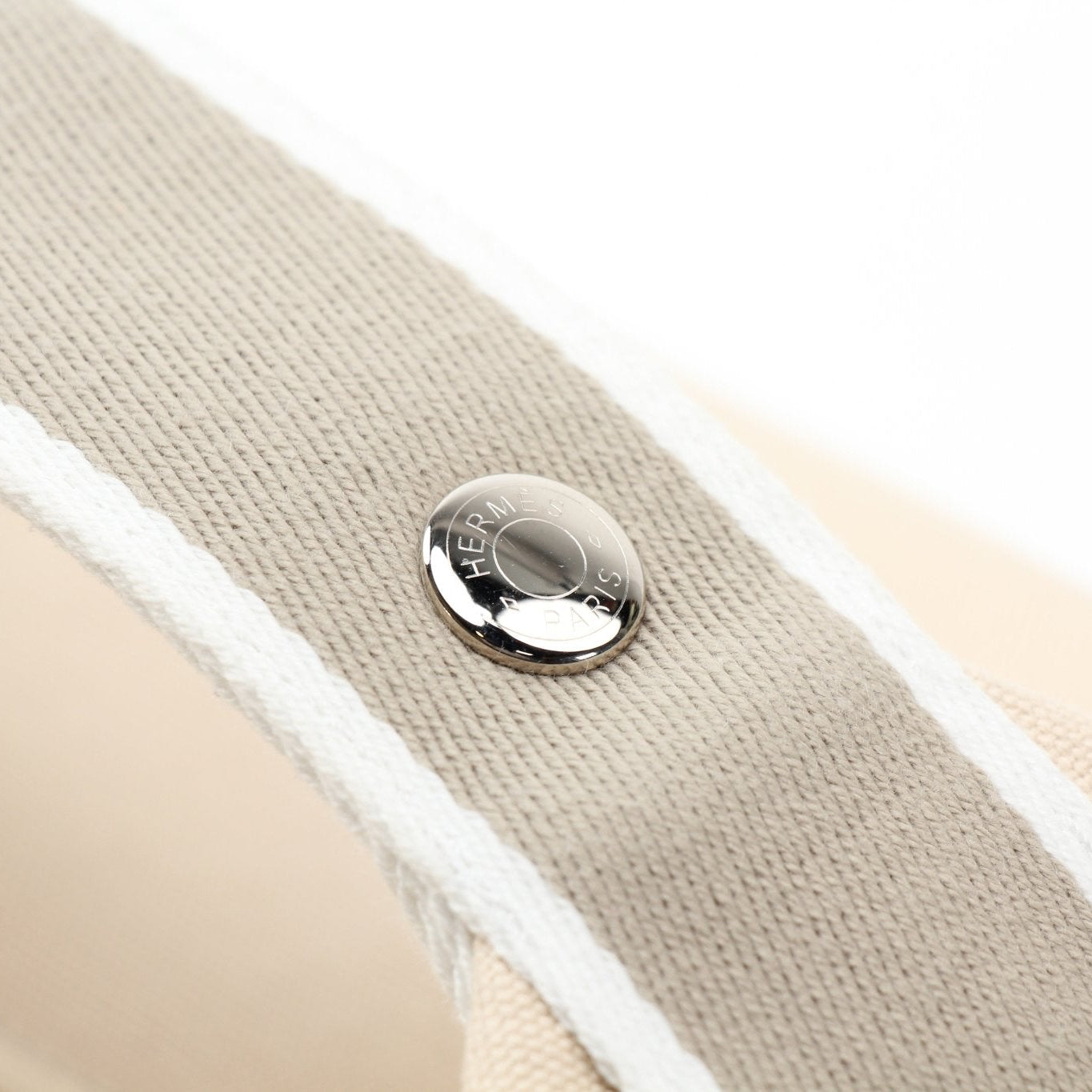 Hermès Bride-a-Brac gray handbag with detailed design, showcasing elegant craftsmanship and luxurious leather material.