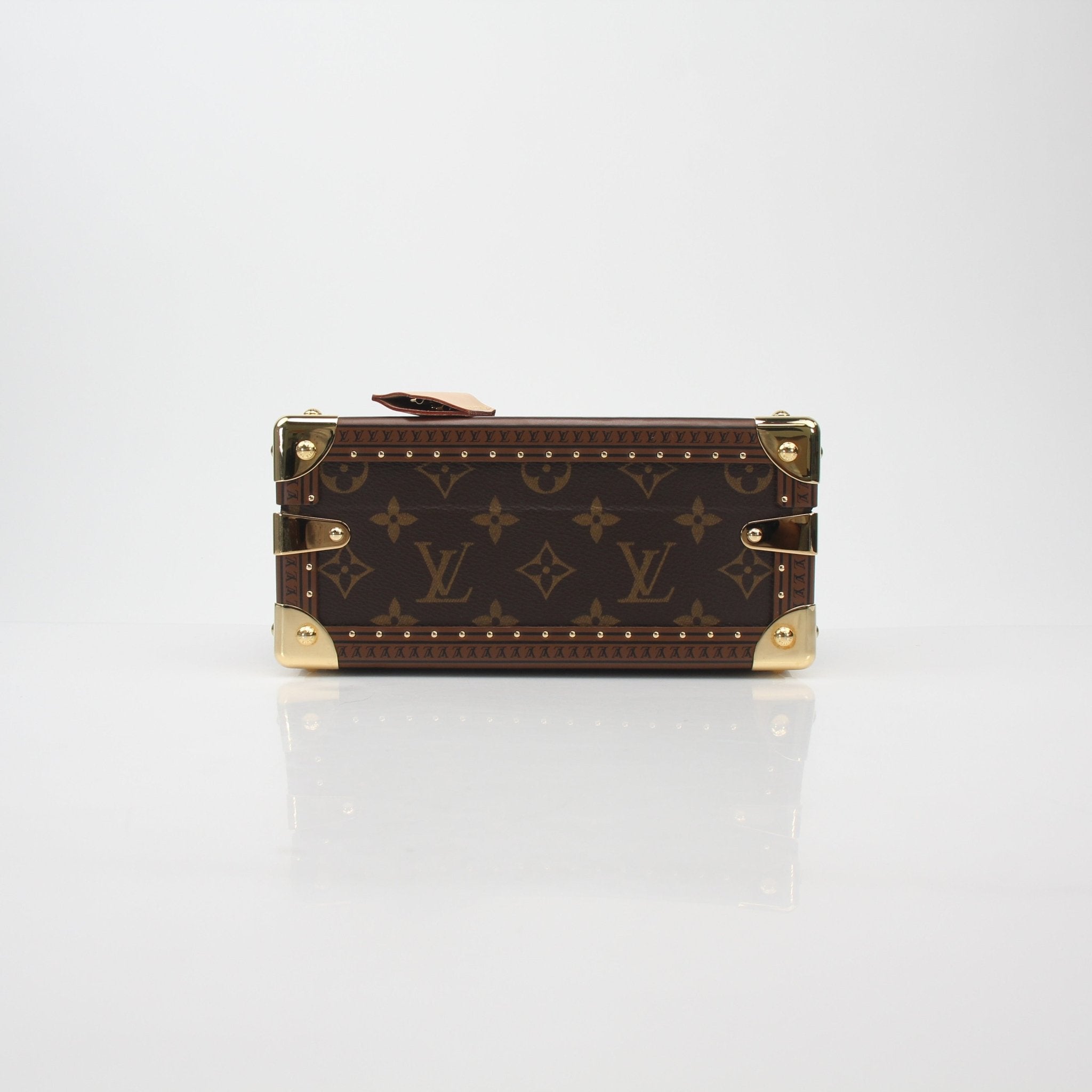 Louis Vuitton Monogram Petite Valise top handle trunk bag with gold hardware and leather accents, displayed on a neutral background.