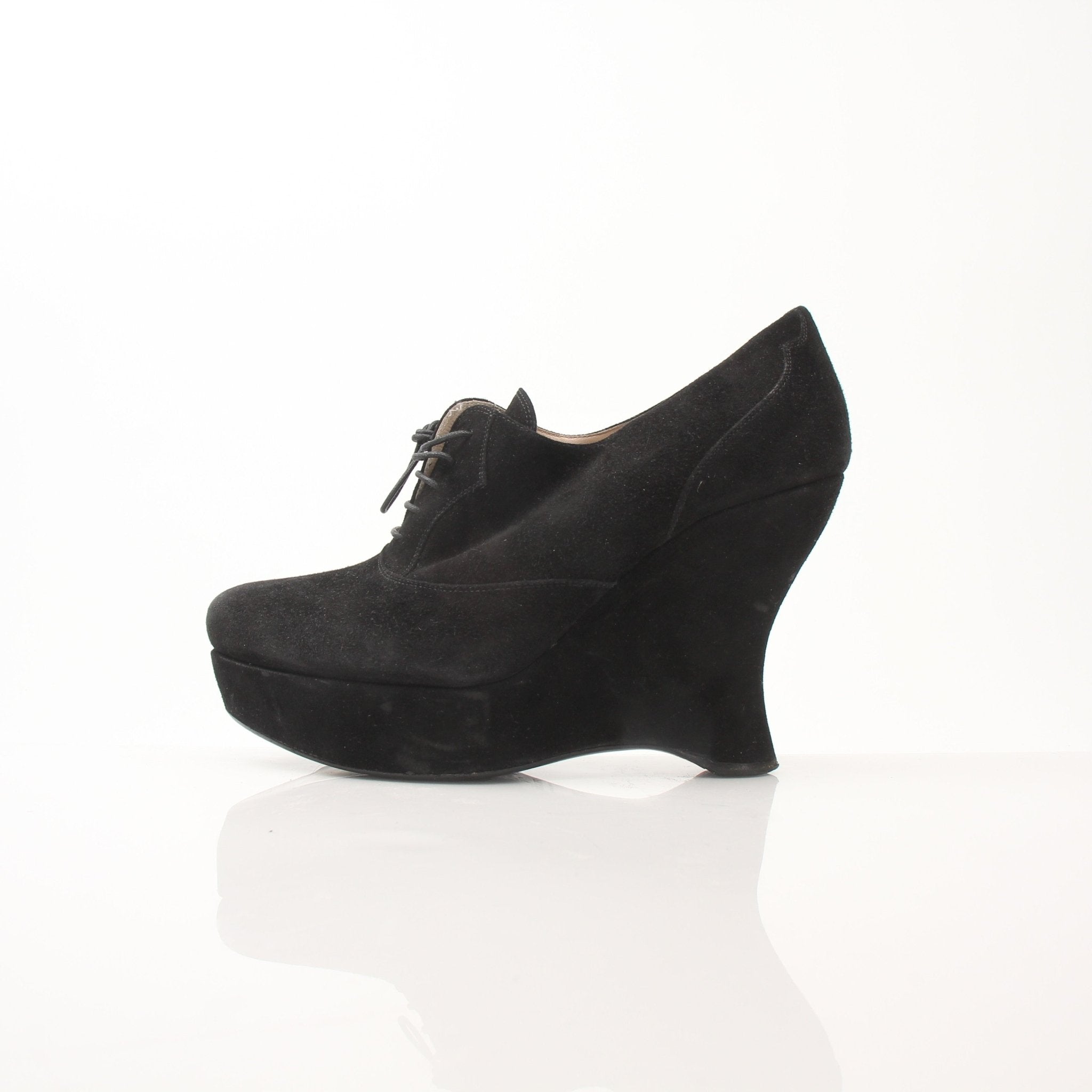 Gold & Beyond Prada women's suede platform wedge ankle boots with chunky heel and ankle-high design.