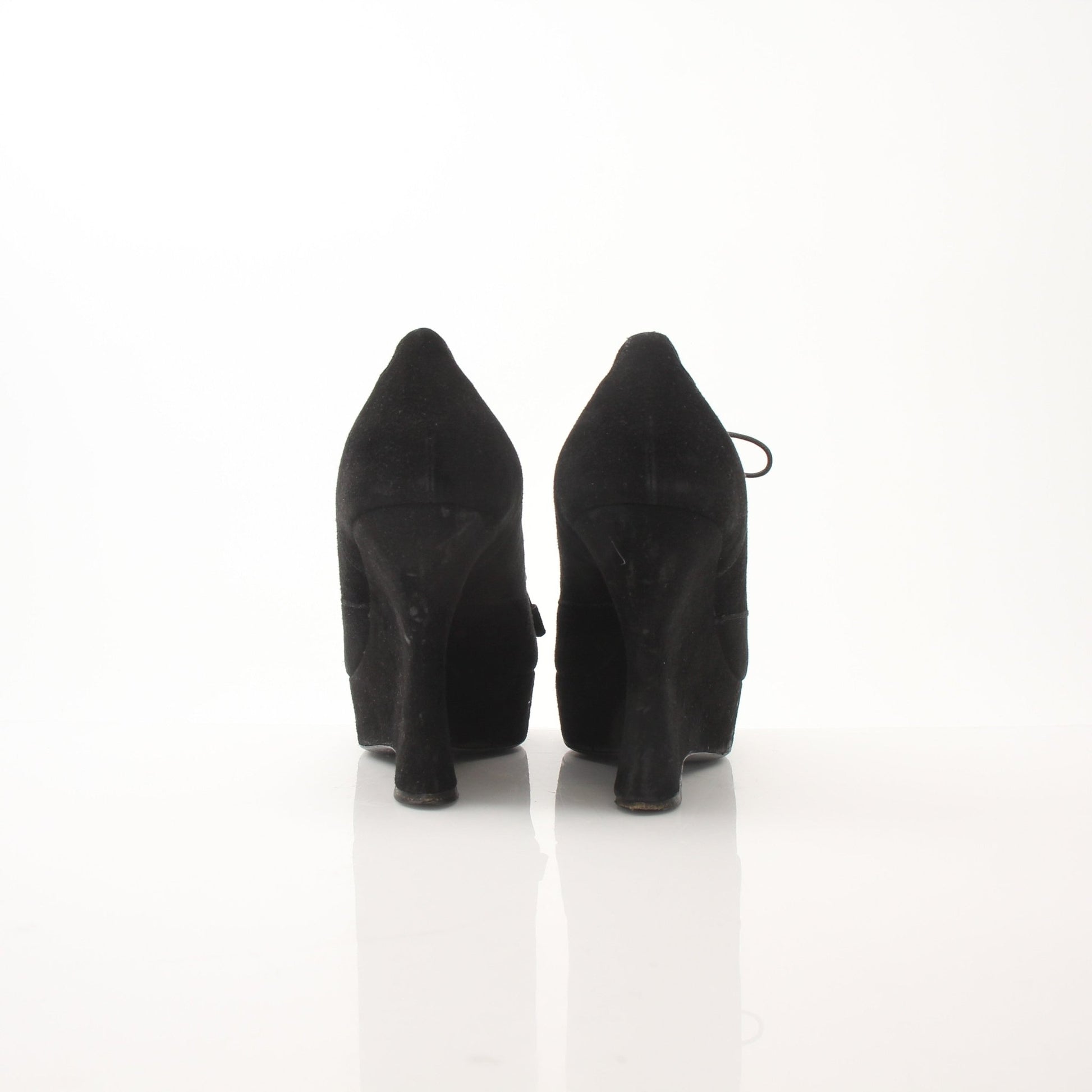 Gold & Beyond Prada women’s suede platform wedge ankle boots with chunky heels and ankle-high design.