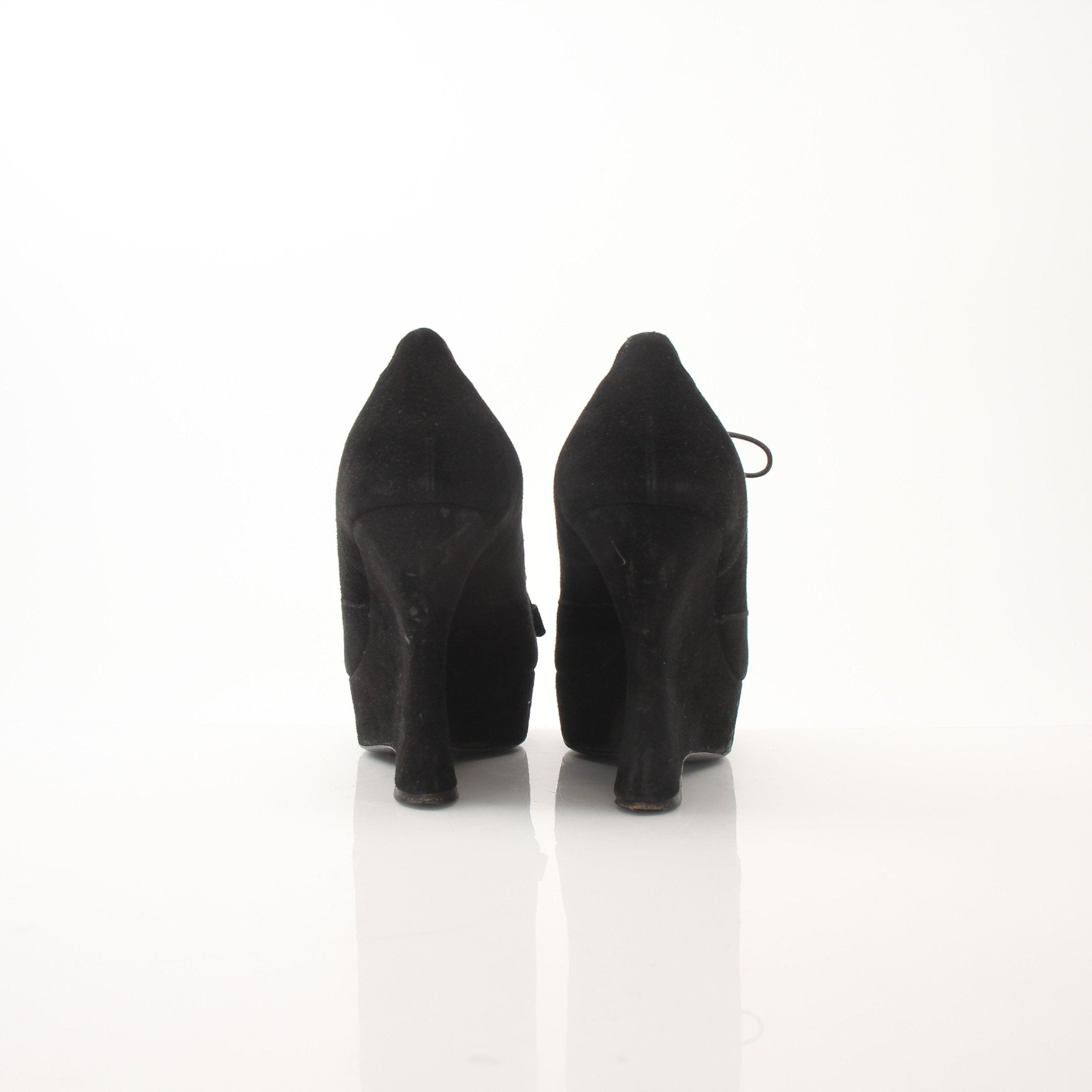 Gold & Beyond Prada women’s suede platform wedge ankle boots with chunky heels and ankle-high design.