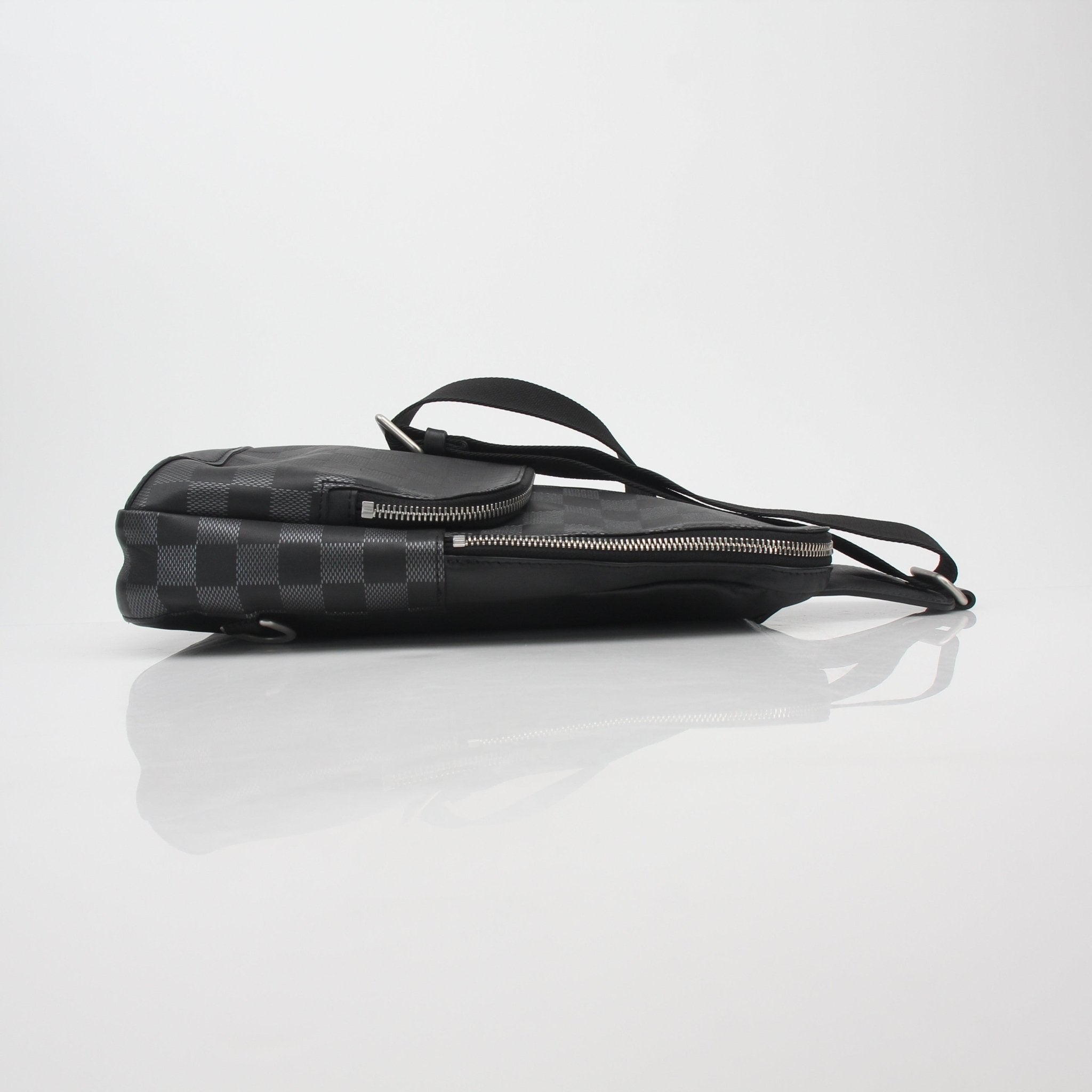 Louis Vuitton Damier Graphite Avenue Sling Bag handbag with adjustable strap and signature checkered pattern on a neutral background
