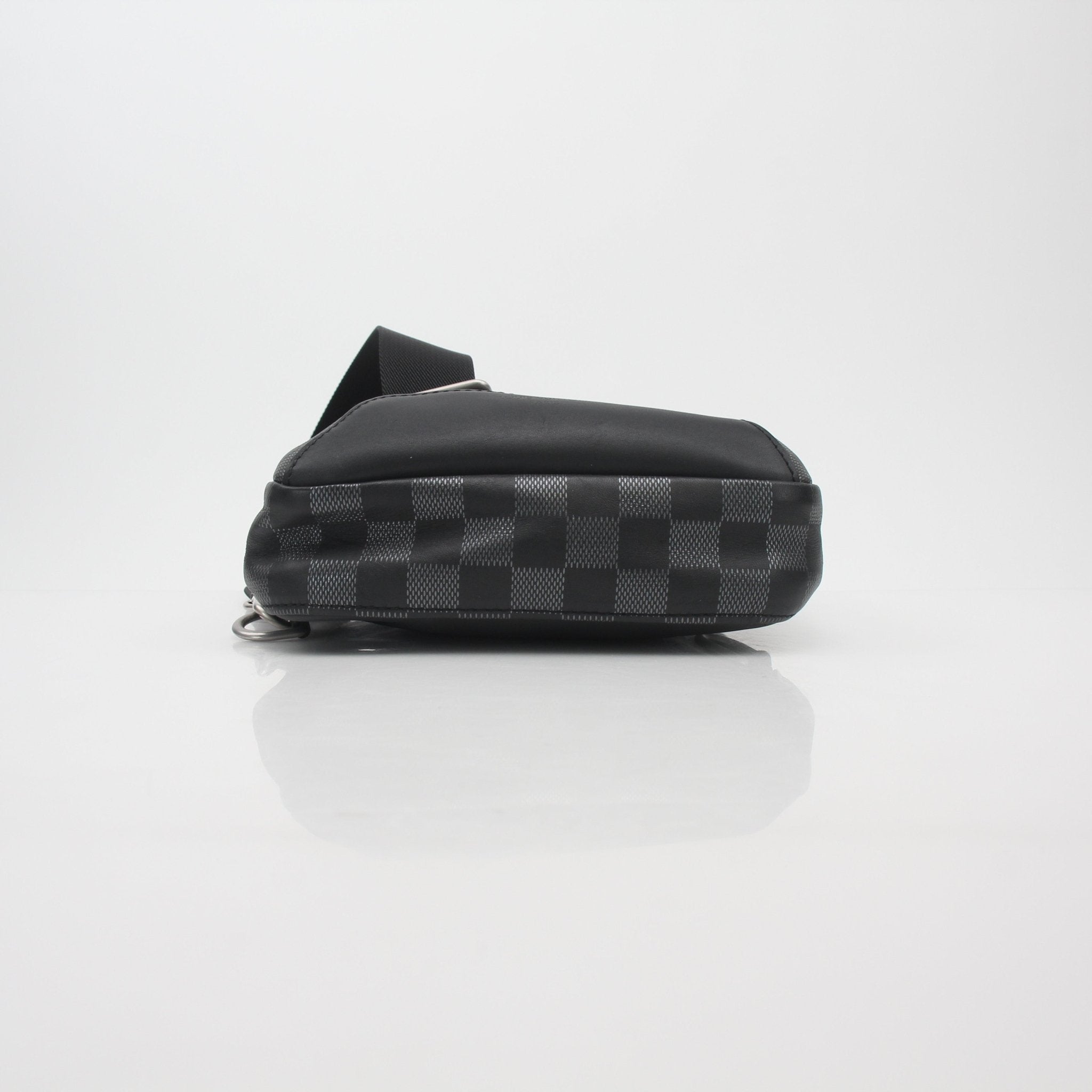 Louis Vuitton Damier Graphite Avenue Sling Bag handbag with adjustable strap and gold hardware, showing the signature checkered pattern.