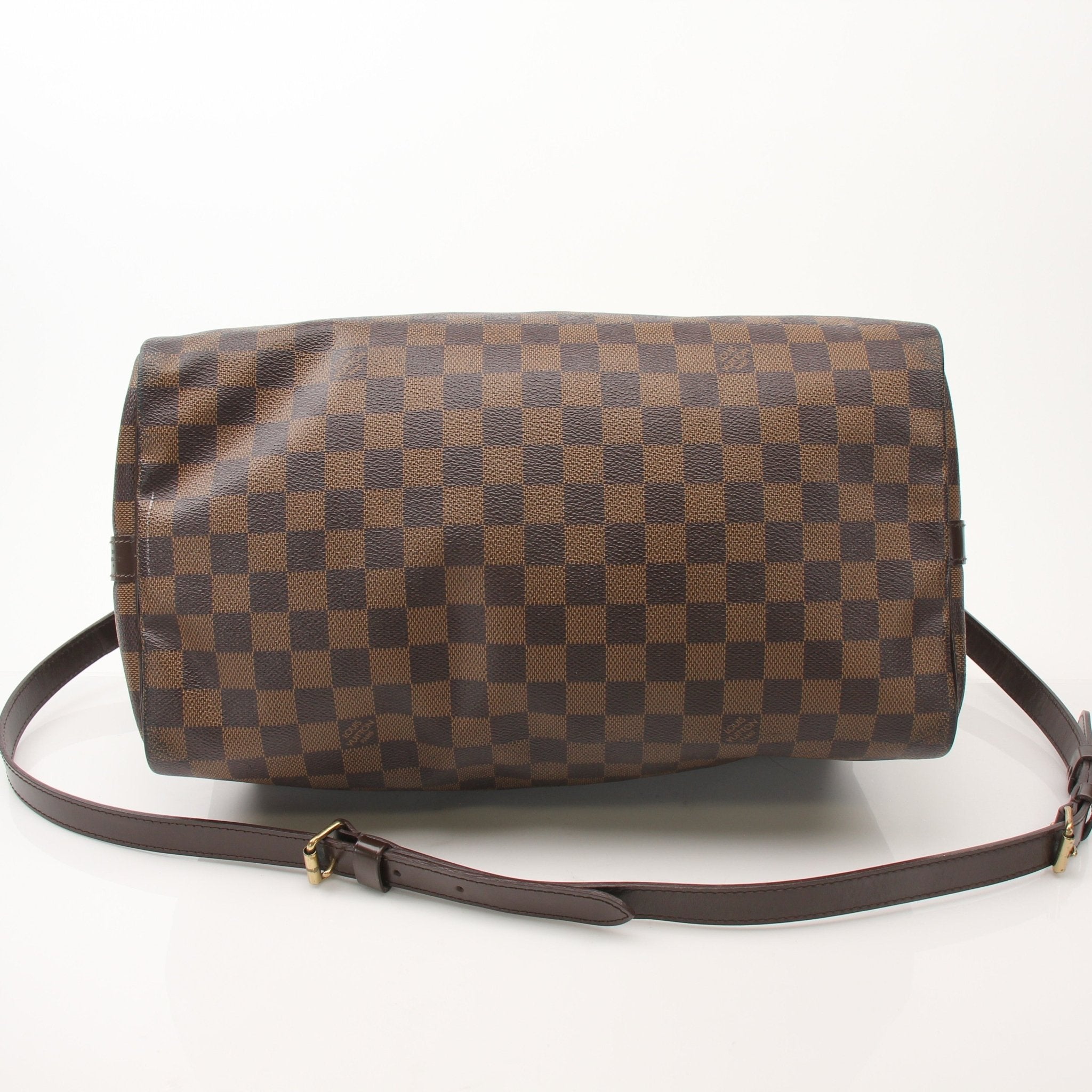 Gold & Beyond Louis Vuitton Speedy Bandouliere 35 shoes with stylish leather design and signature LV details.