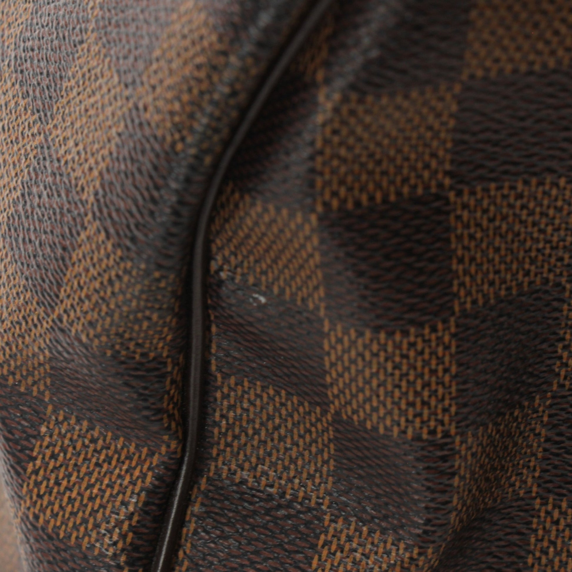 Gold & Beyond Louis Vuitton Speedy Bandouliere 35 shoes with sleek design and luxurious details, displayed on a neutral background.