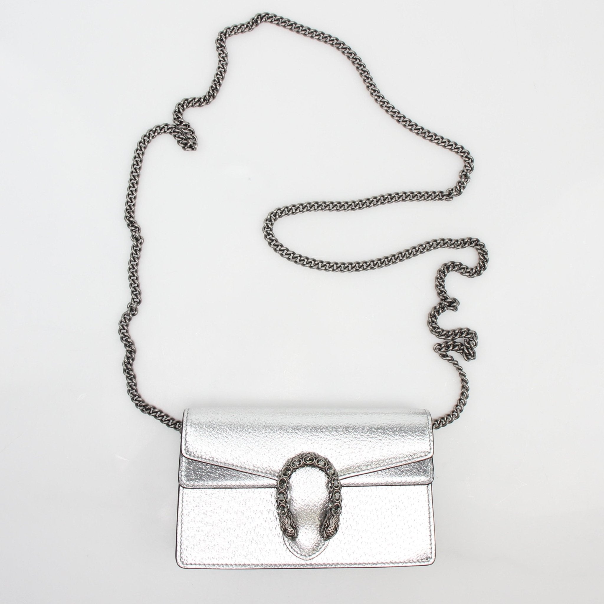 Silver metallic Gucci Dionysus Super Mini shoulder handbag with chain strap and gold-tone hardware, stylish and compact.
