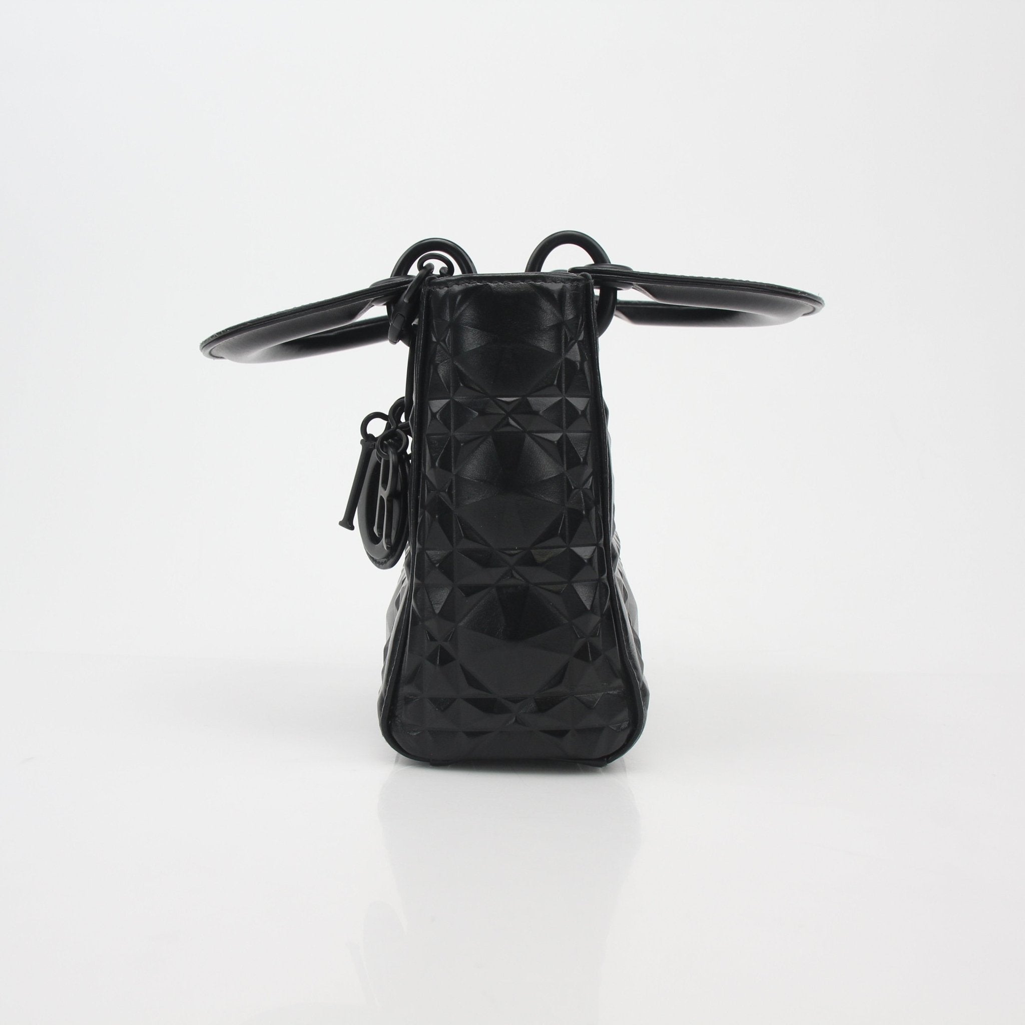 Black mini Lady Dior tote handbag by Christian Dior featuring gold hardware and signature Cannage quilting.