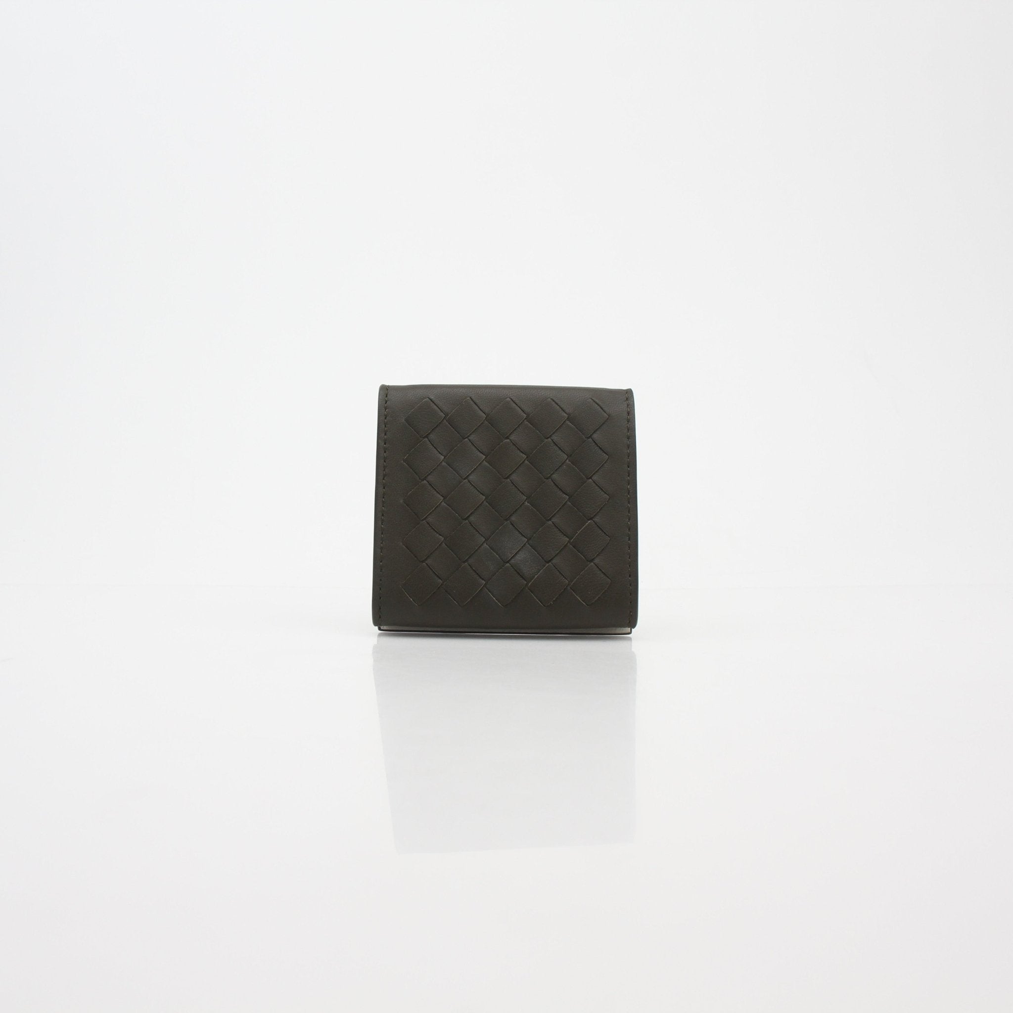 Dark green Bottega Veneta Intrecciato leather trifold coin wallet with multiple card slots and compact design.