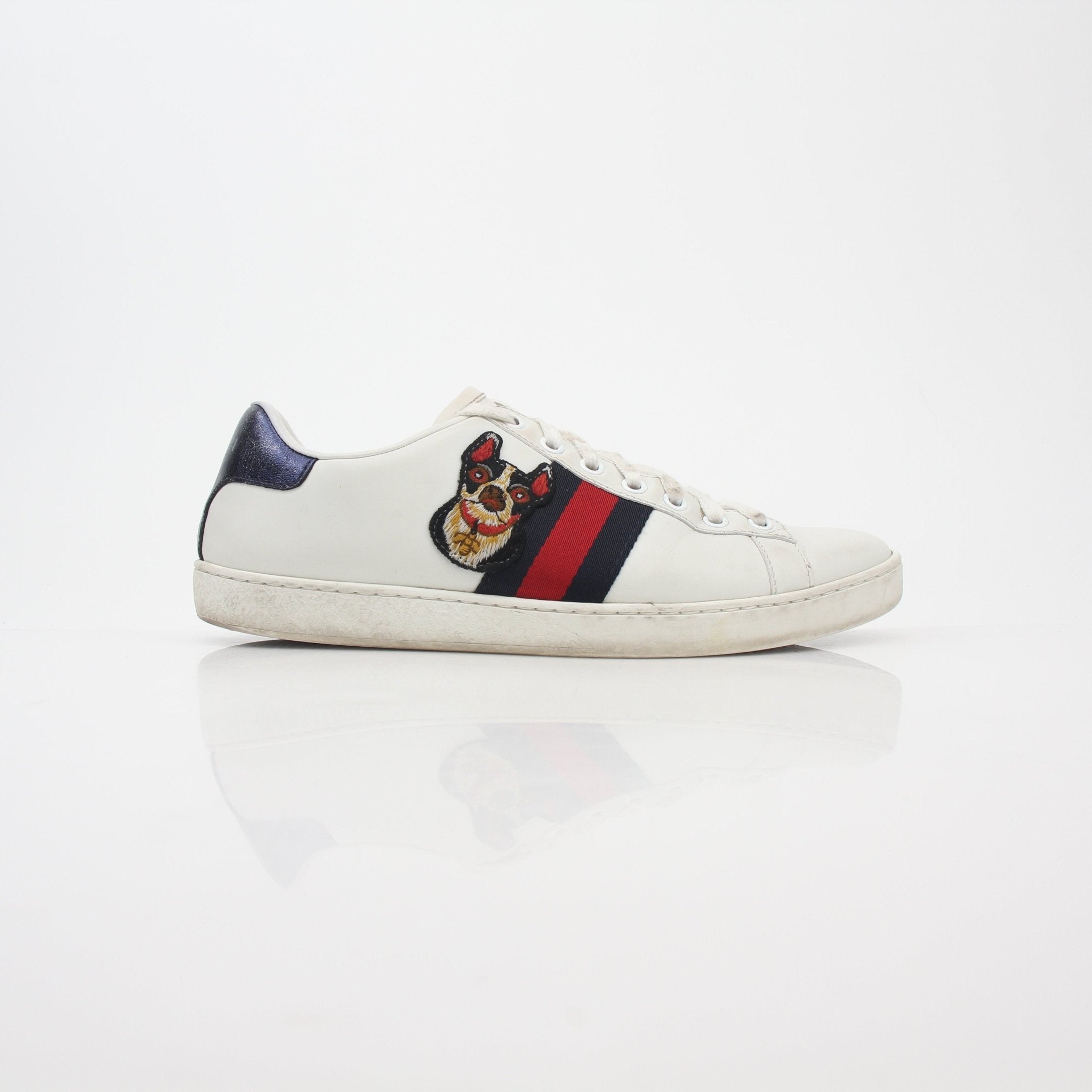 Gucci White Ace embroidered leather sneakers with gold accents, stylish and casual footwear for men.
