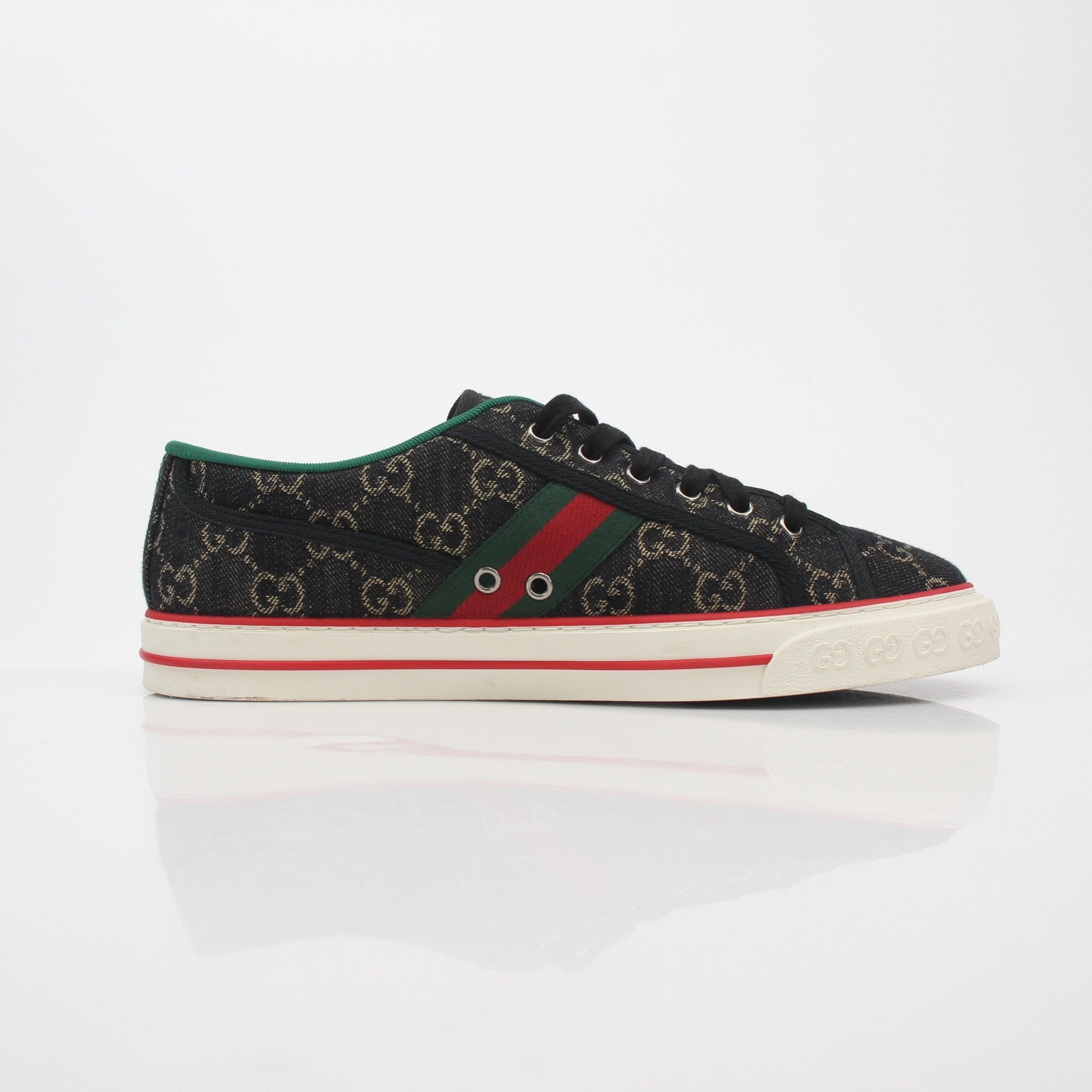 Gucci Black GG Denim Tennis 1977 Low-Top Sneakers with white rubber soles and gold accents, casual shoe for men and women.