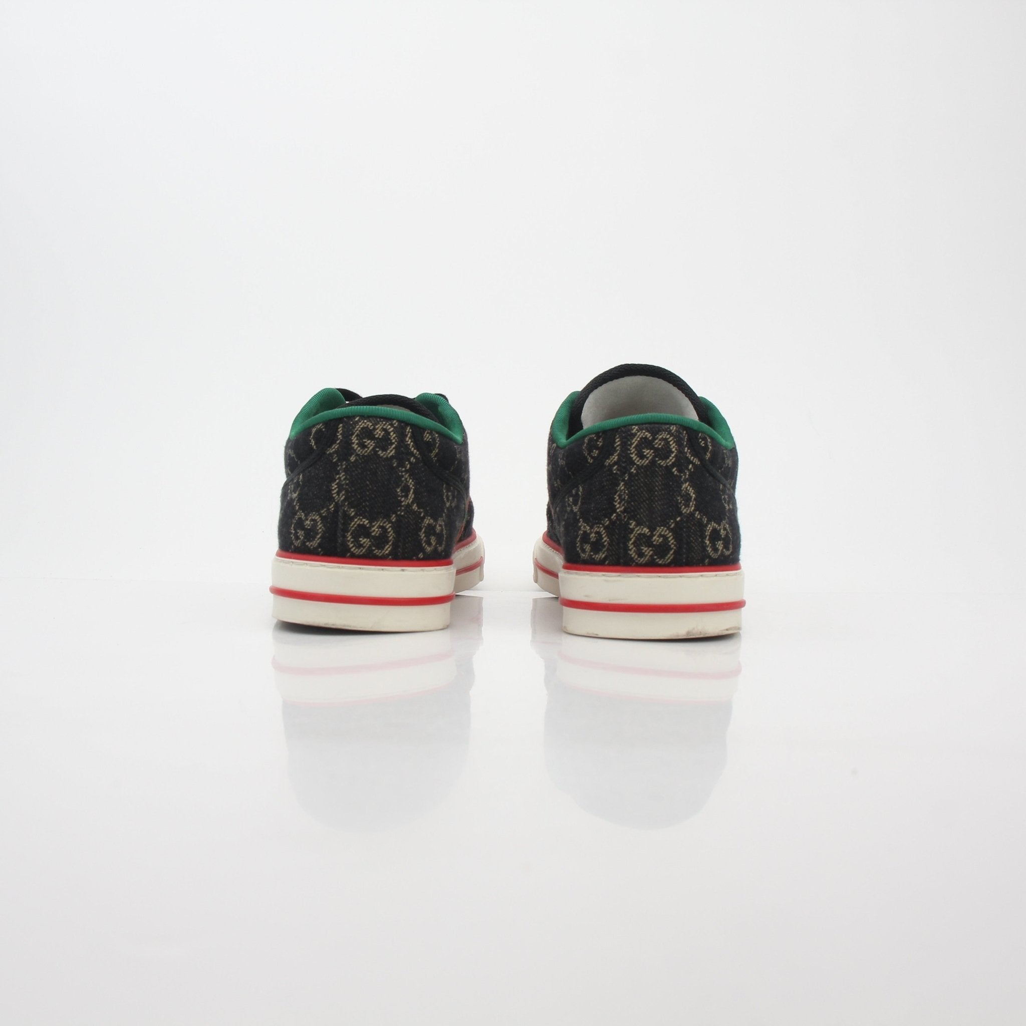 Gold & Beyond Gucci Black GG Denim Tennis 1977 Low-Top Sneakers with white soles and classic logo detail.
