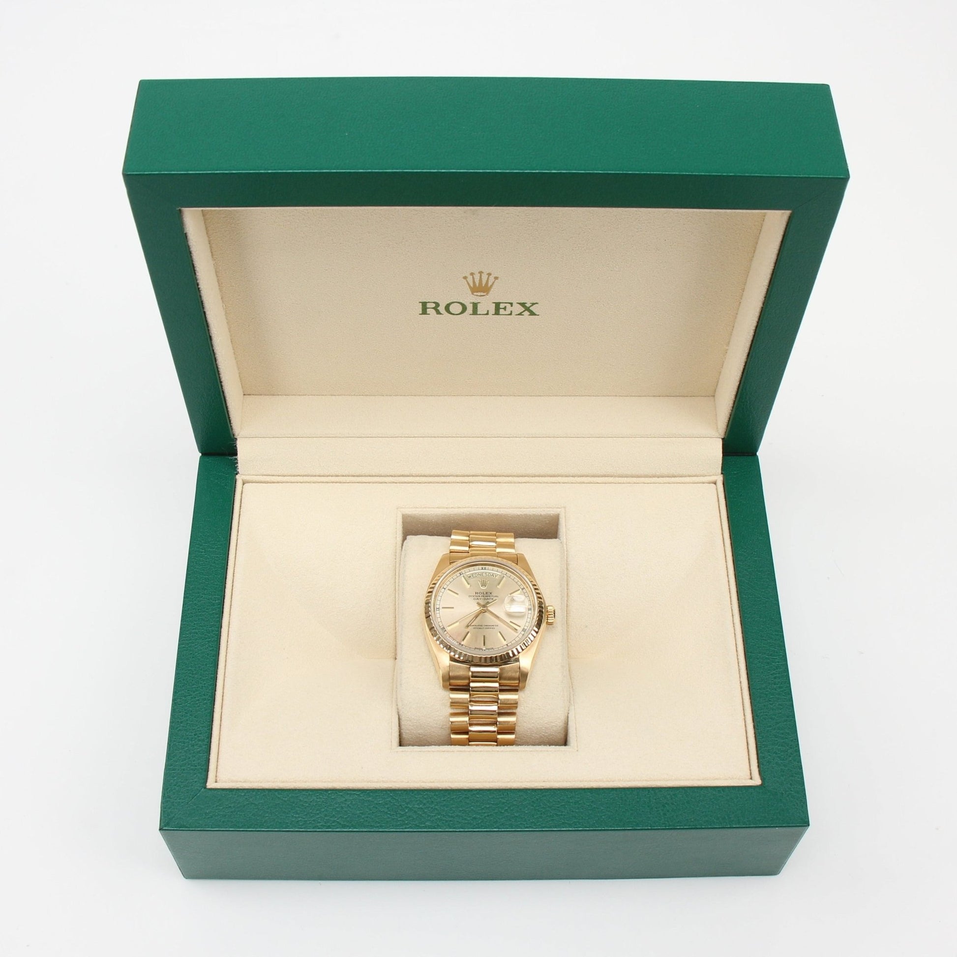 Gold & Beyond Rolex Day-Date 36 gold watch with a sleek design and classic dial, showcasing luxury timepiece craftsmanship.