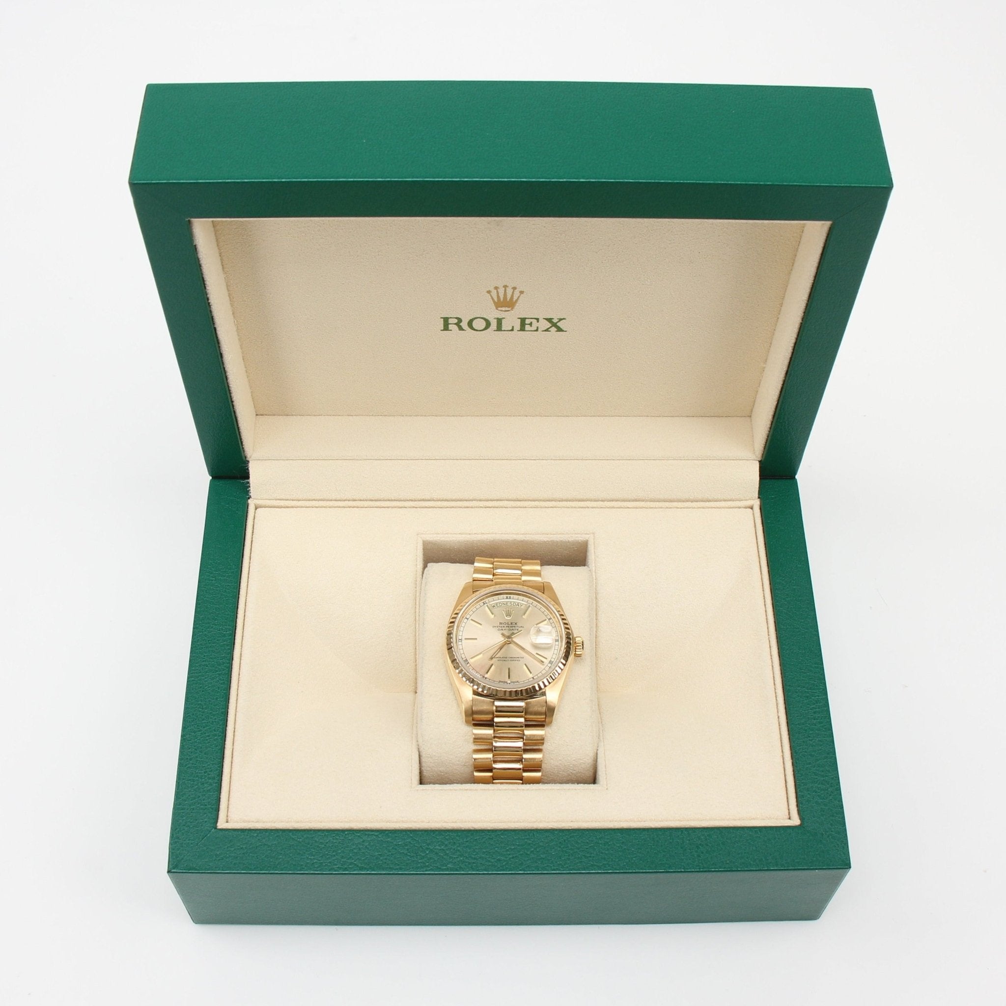 Gold & Beyond Rolex Day-Date 36 gold watch with a sleek design and classic dial, showcasing luxury timepiece craftsmanship.