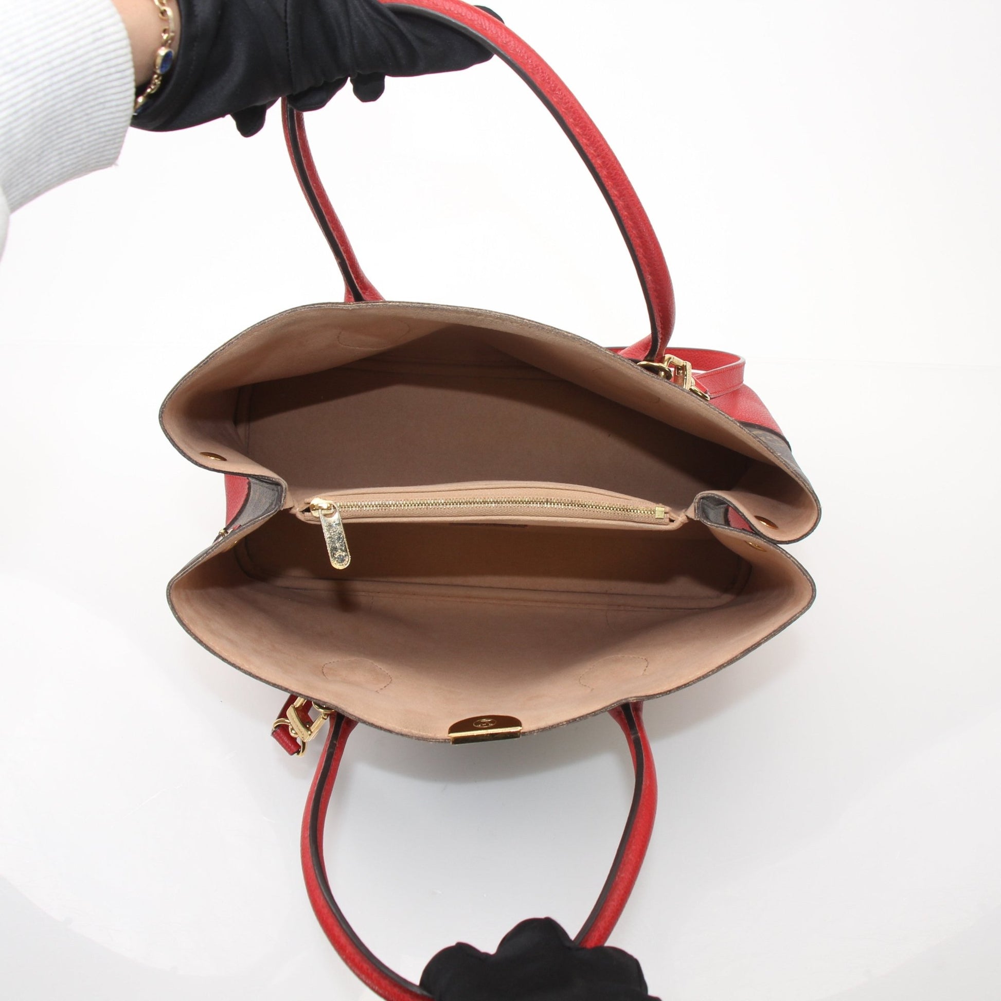 Gold & Beyond Louis Vuitton Flandrin tote handbag with leather handles and monogram canvas, shown in a close-up shot.