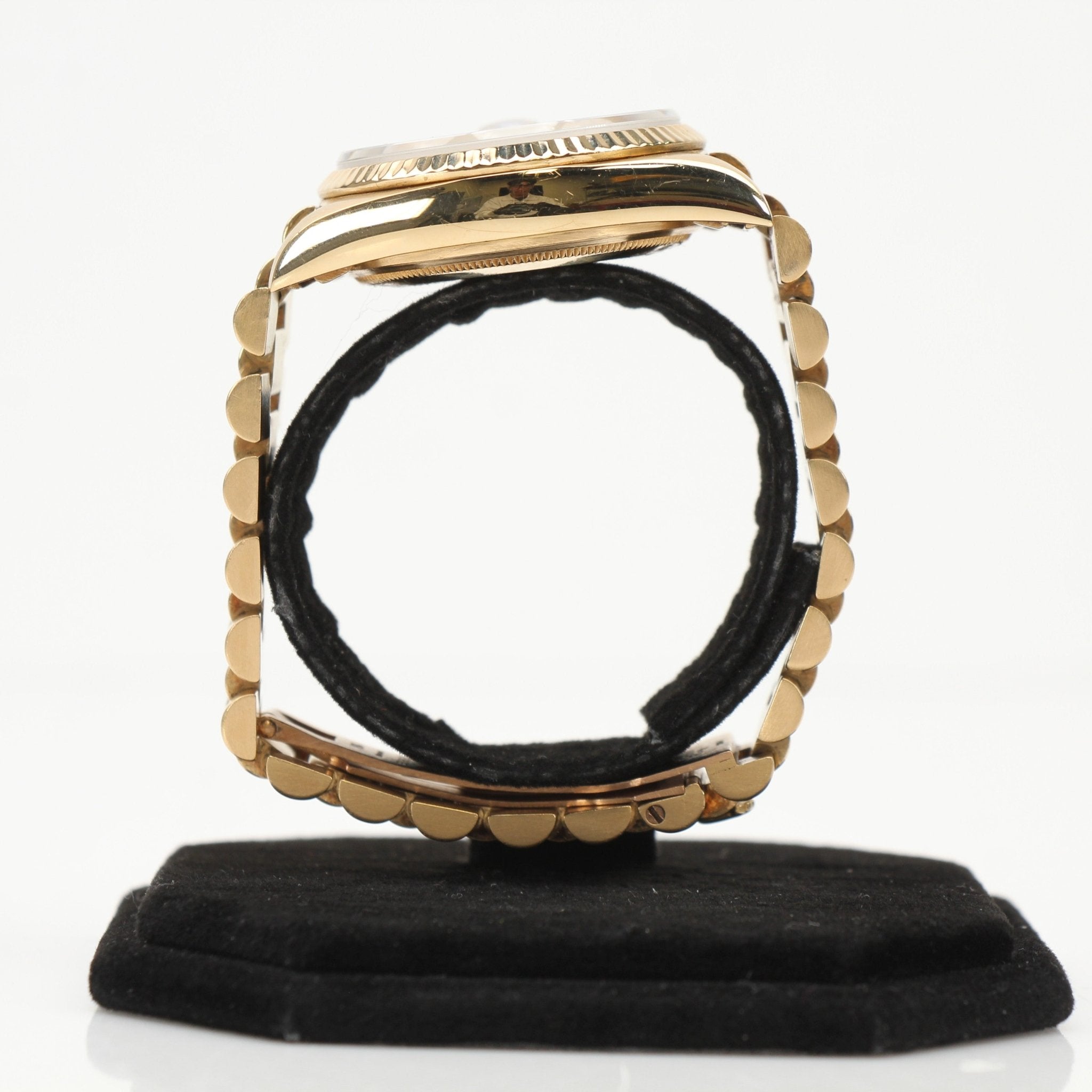 Gold & Beyond Rolex Day-Date 36 gold watch with a classic design and gold bracelet, showcasing luxury and elegance.