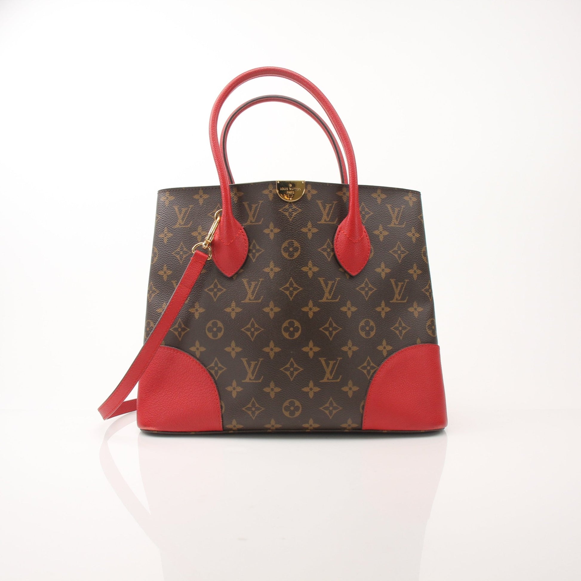 Gold & Beyond Louis Vuitton Flandrin tote handbag with leather handles and signature monogram canvas, shown from a front angle.