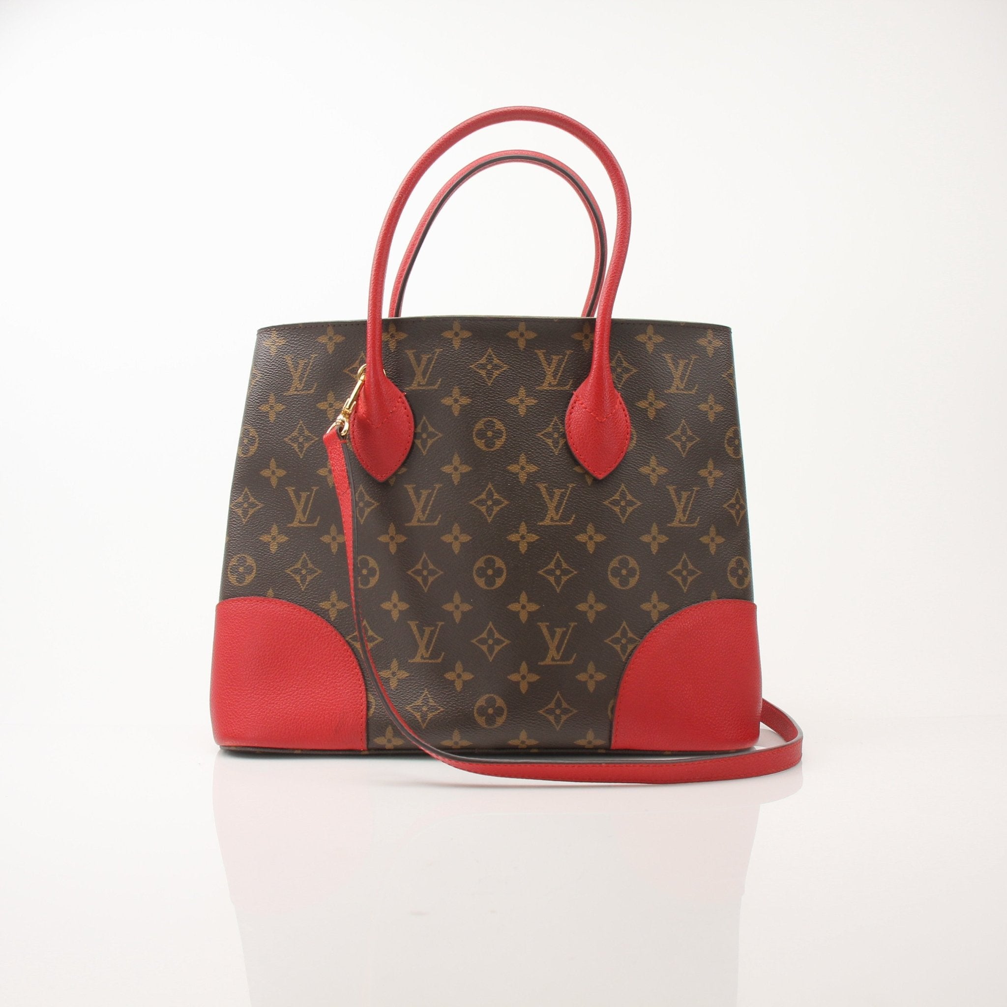 Gold & Beyond Louis Vuitton Flandrin tote handbag with leather handles and monogram canvas, stylish and spacious for everyday use.