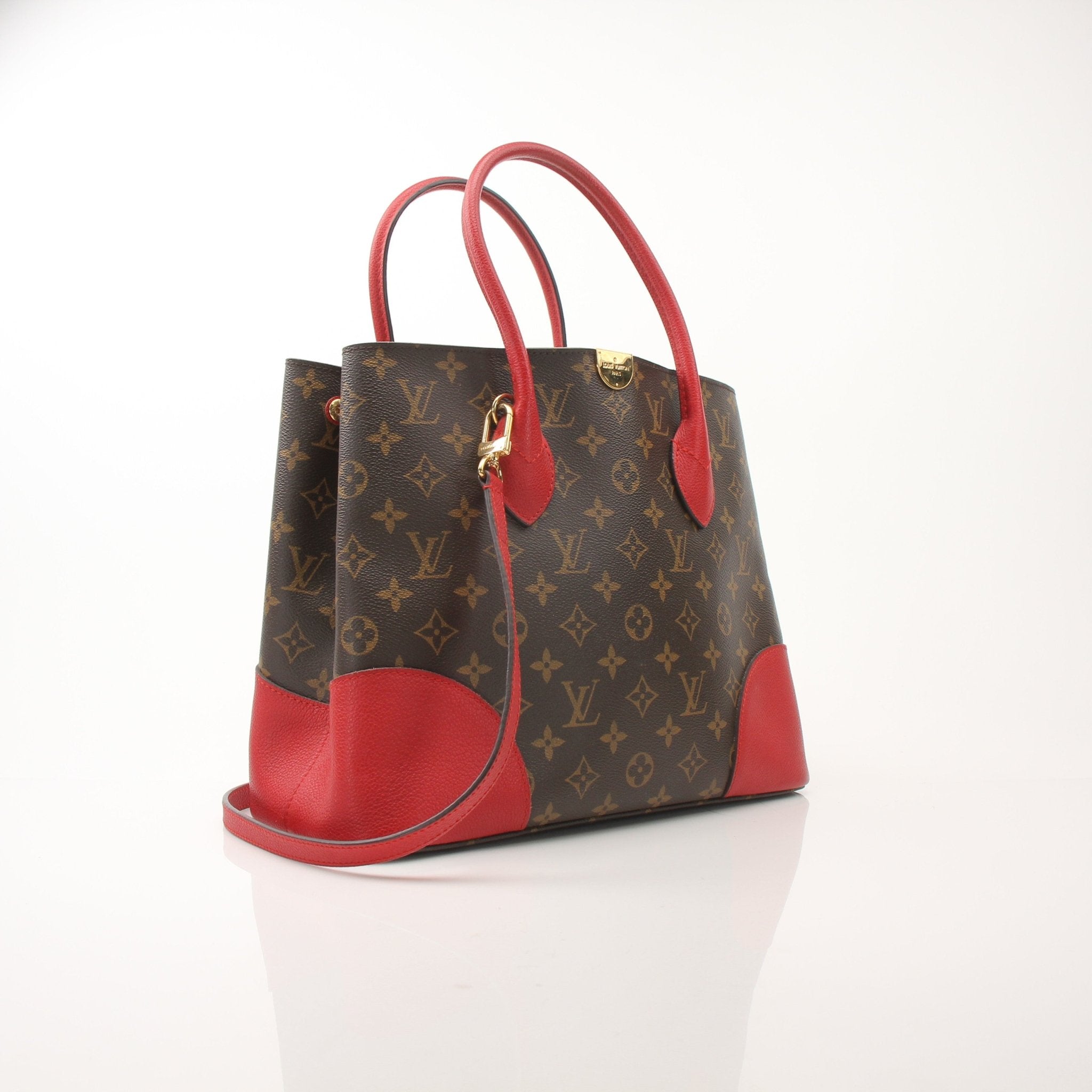 Louis Vuitton Flandrin tote bag handbag in monogram canvas with leather handles and gold-tone hardware.