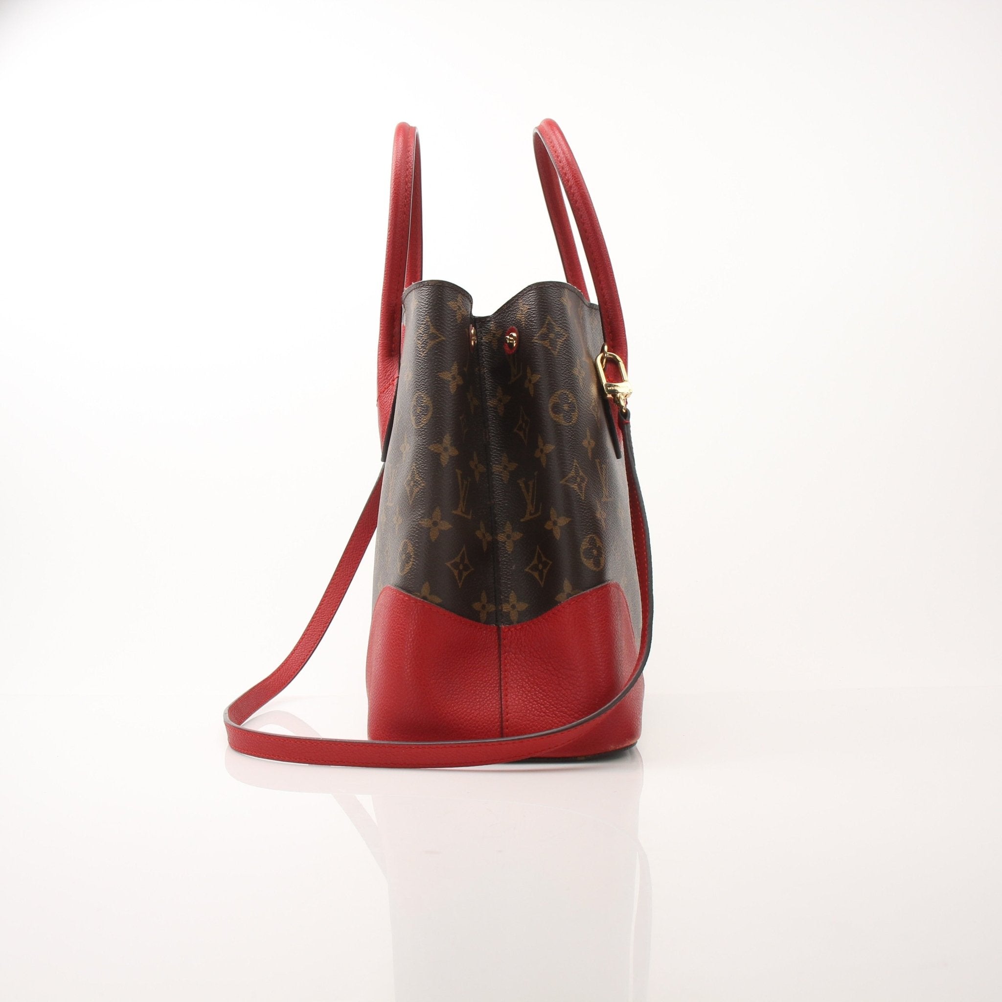Gold & Beyond Louis Vuitton Flandrin tote handbag with leather handles and monogram canvas, displayed on a neutral background.