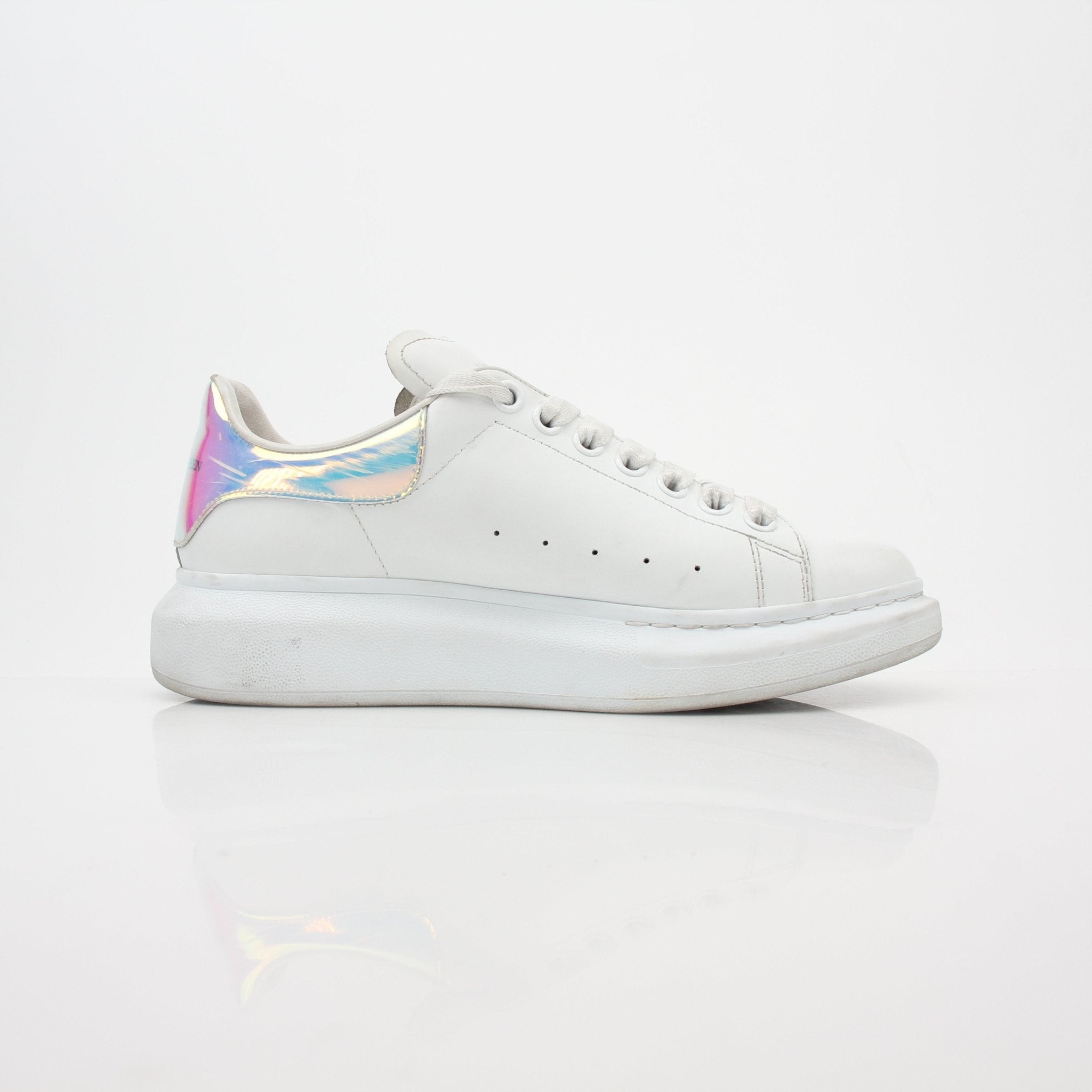 Alexander McQueen white oversized iridescent heel sneakers with chunky design and bold soles, stylish shoes from Gold & Beyond.