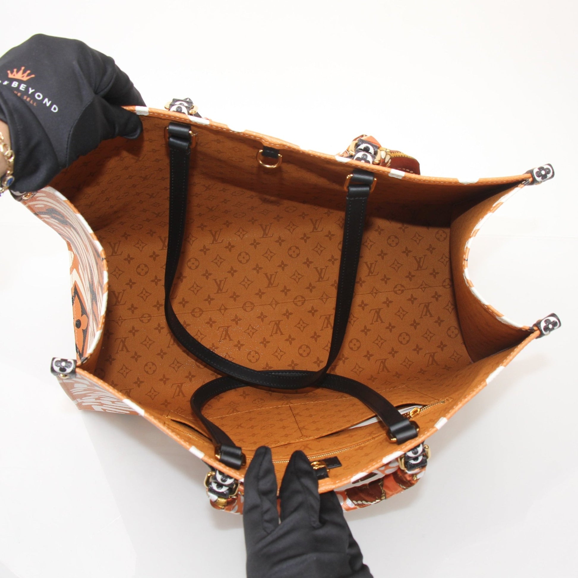 Gold & Beyond Louis Vuitton OnTheGo Crafty GM tote handbag with leather handles and spacious interior, showcasing stylish design.
