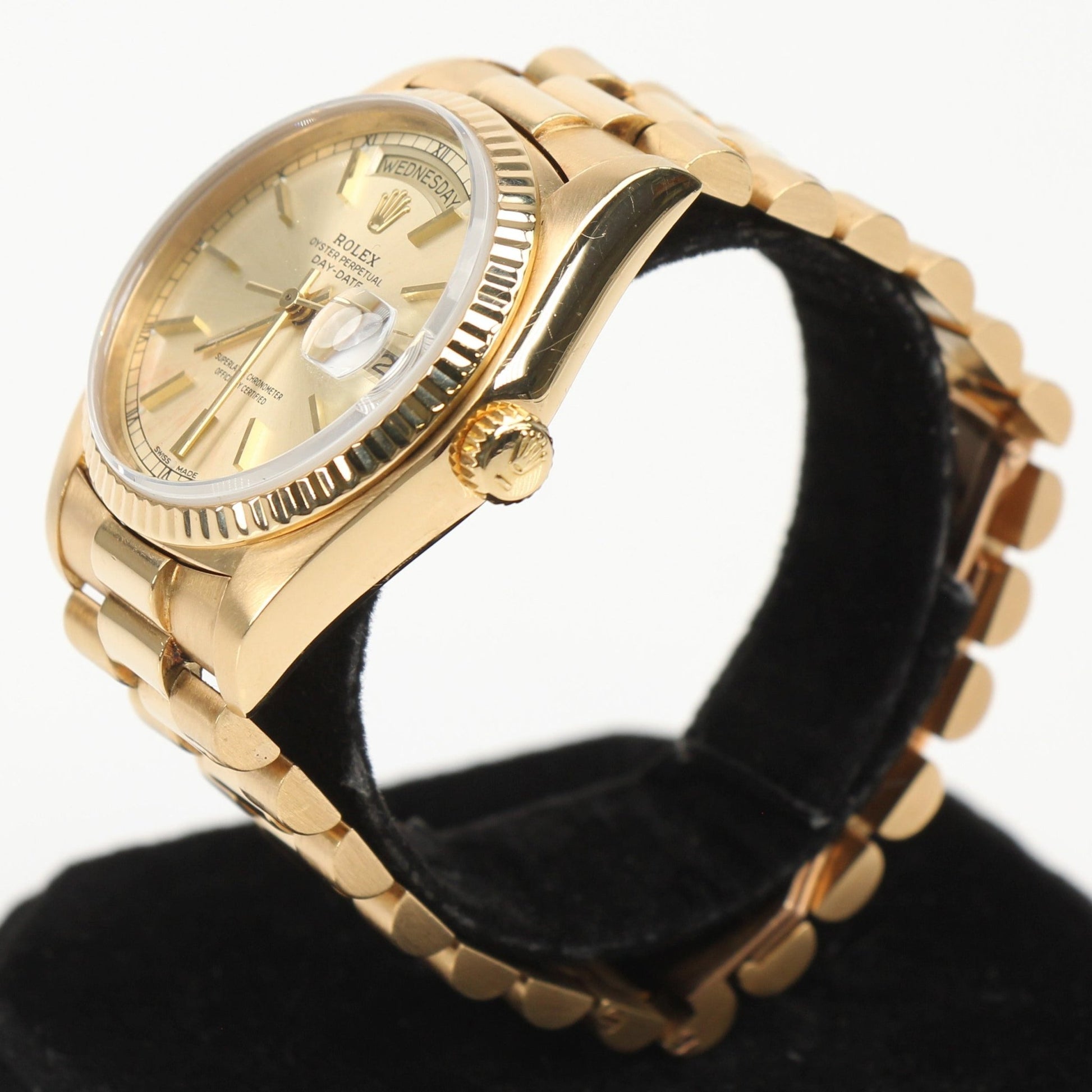 Gold & Beyond Rolex Day-Date 36 gold watch with a sleek gold case and bracelet, elegant dial, and classic design.