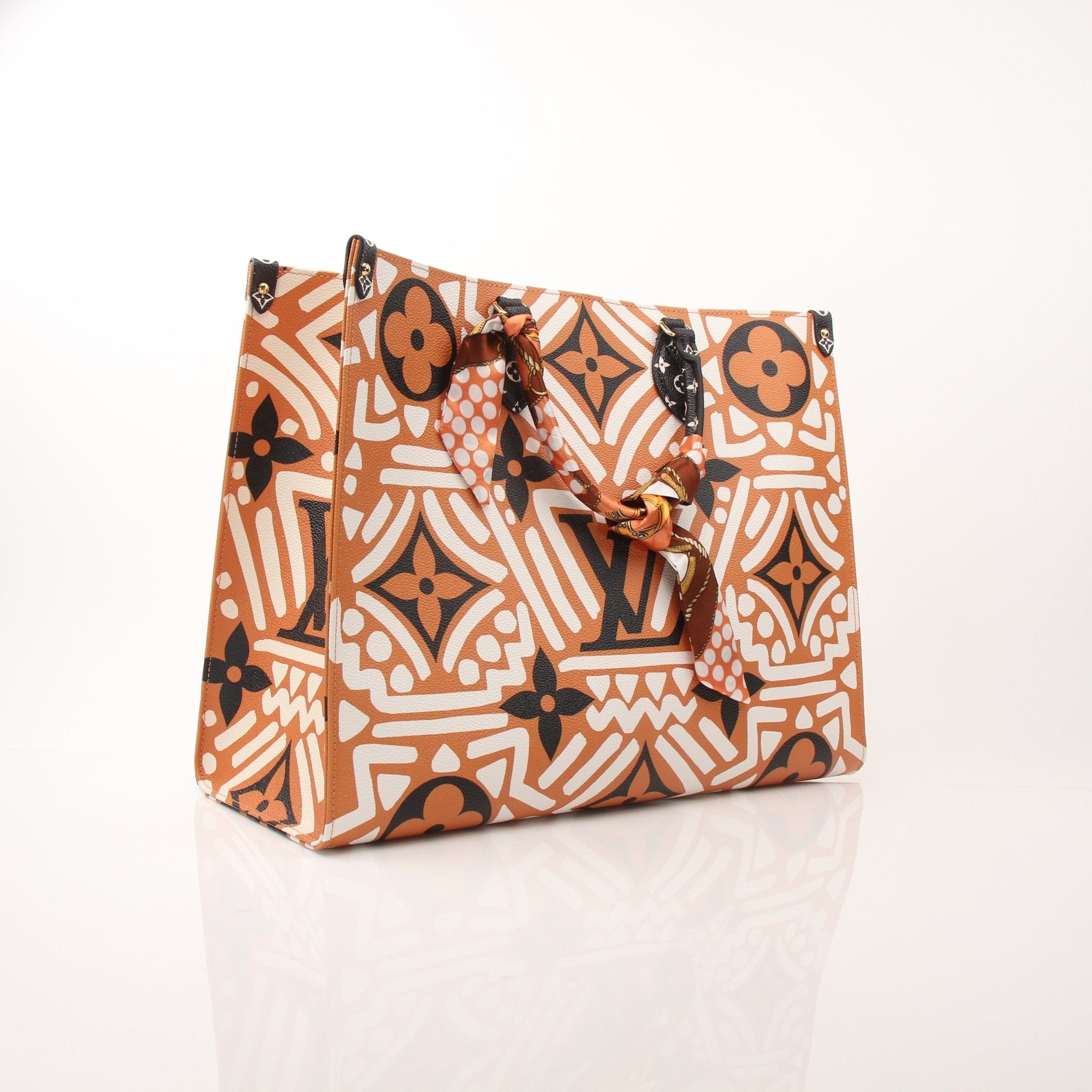 Gold & Beyond Louis Vuitton OnTheGo Crafty GM tote handbag with leather handles and spacious interior.