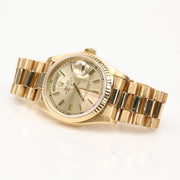 Gold Rolex Day-Date 36 watch with gold bracelet and classic dial, showcased by Gold & Beyond.