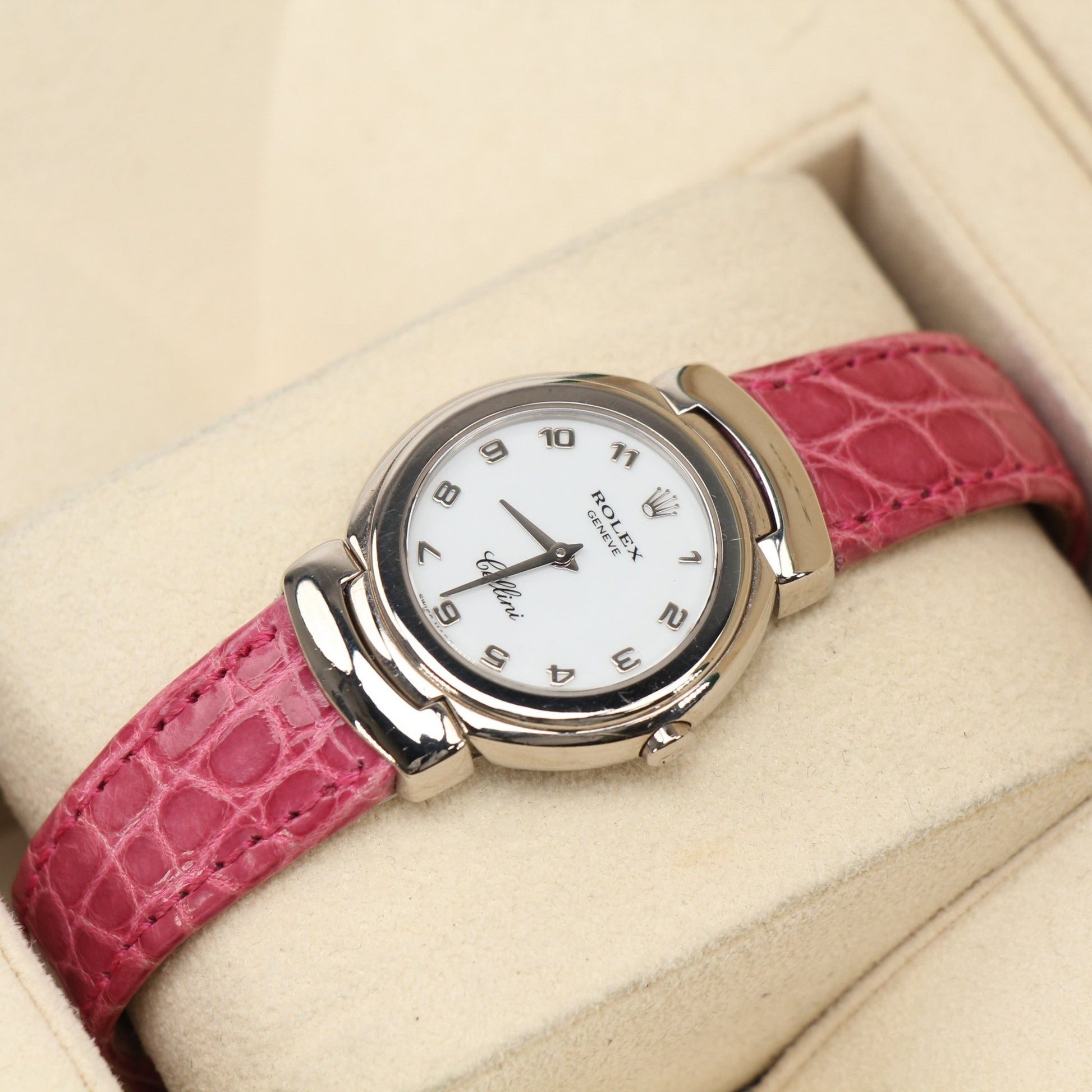 Rolex Cellini watch with gold case and leather strap, showcasing elegant design and classic timepiece features.