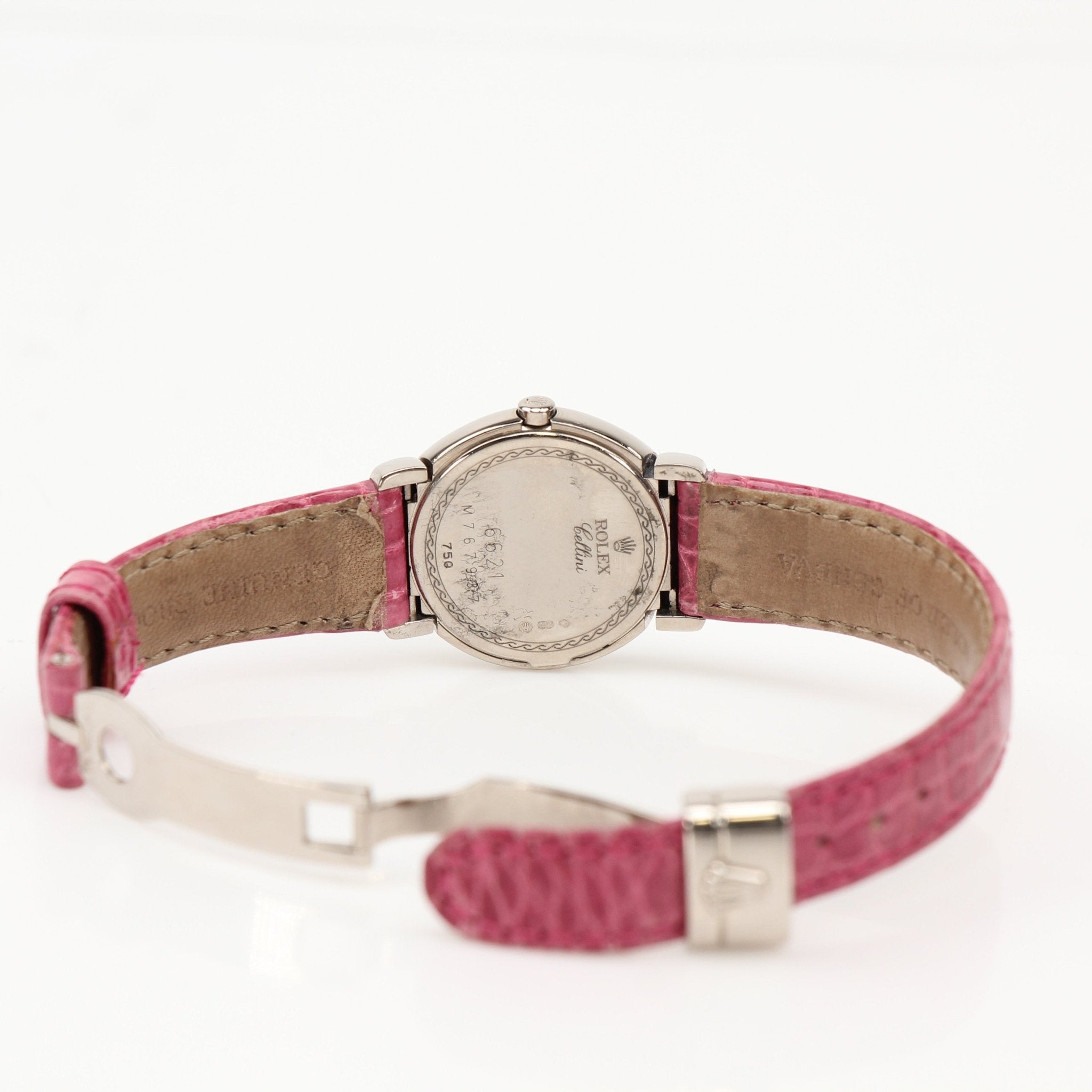 Rolex Cellini watch with gold case and leather strap, elegant timepiece displayed on a white background.