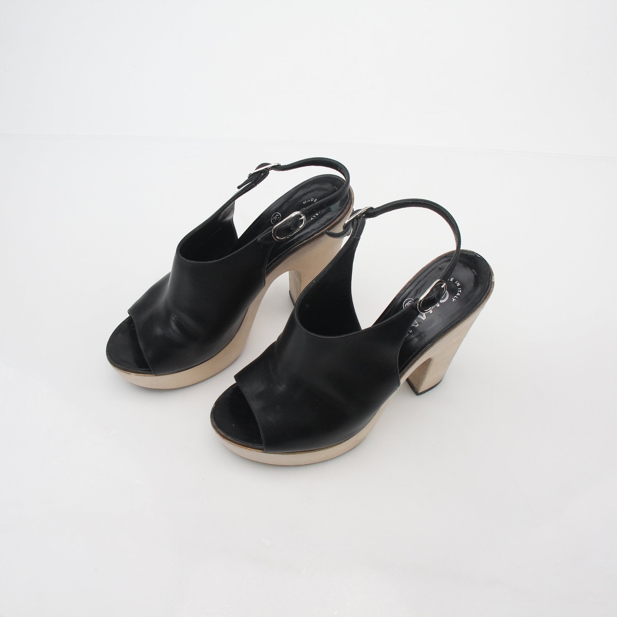 Gold & Beyond Chanel black leather interlocking CC slingback platform heels with ankle straps and chunky heel.