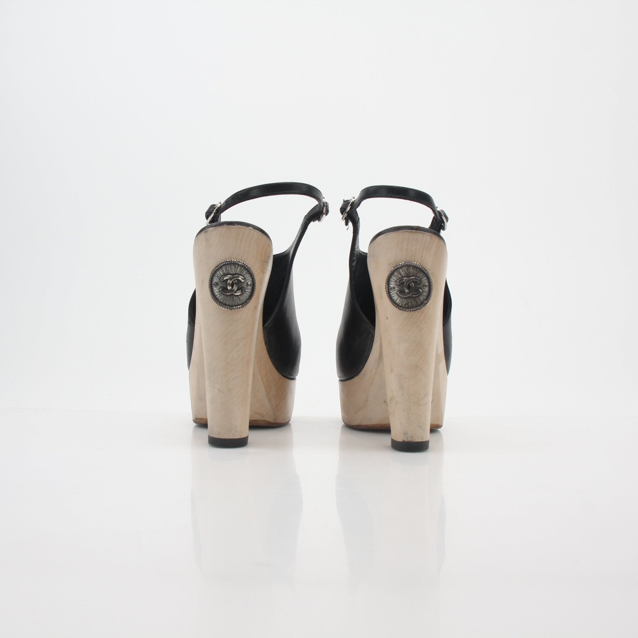 Gold & Beyond Chanel black leather interlocking CC slingback platform heels with stylish design and comfortable heel height.