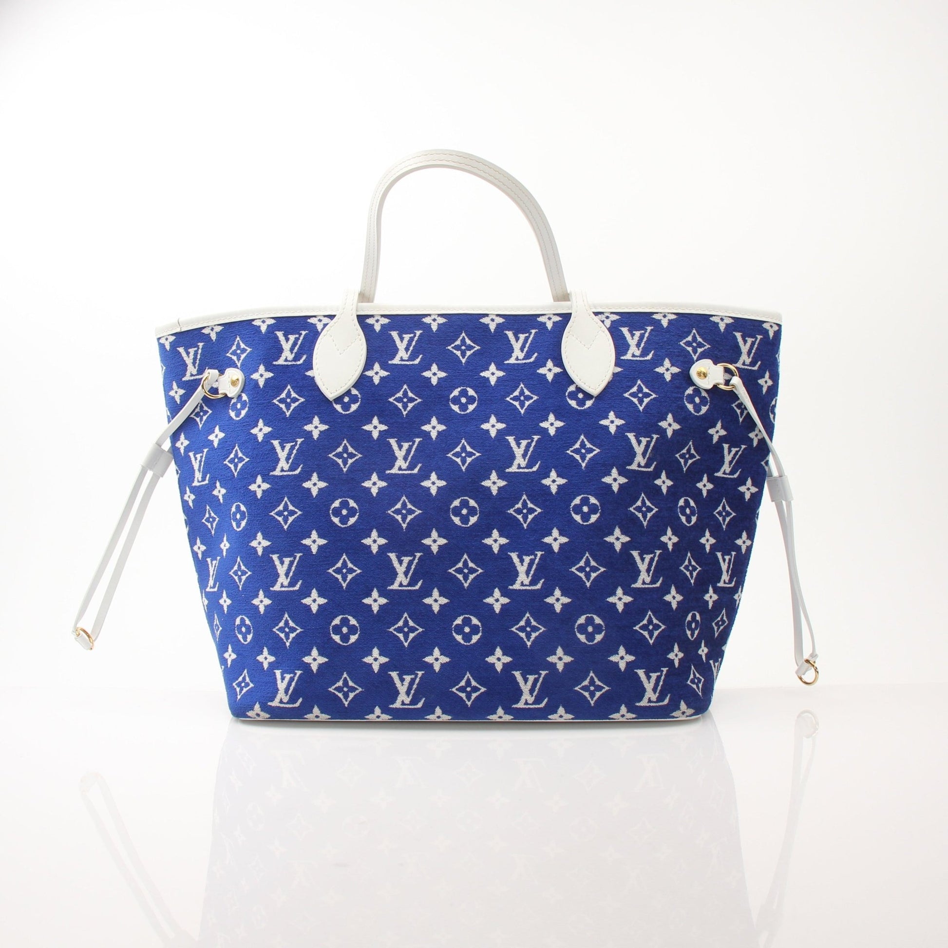 Louis Vuitton LV Match Neverfull MM handbag with gold accents, featuring monogram canvas and leather handles.