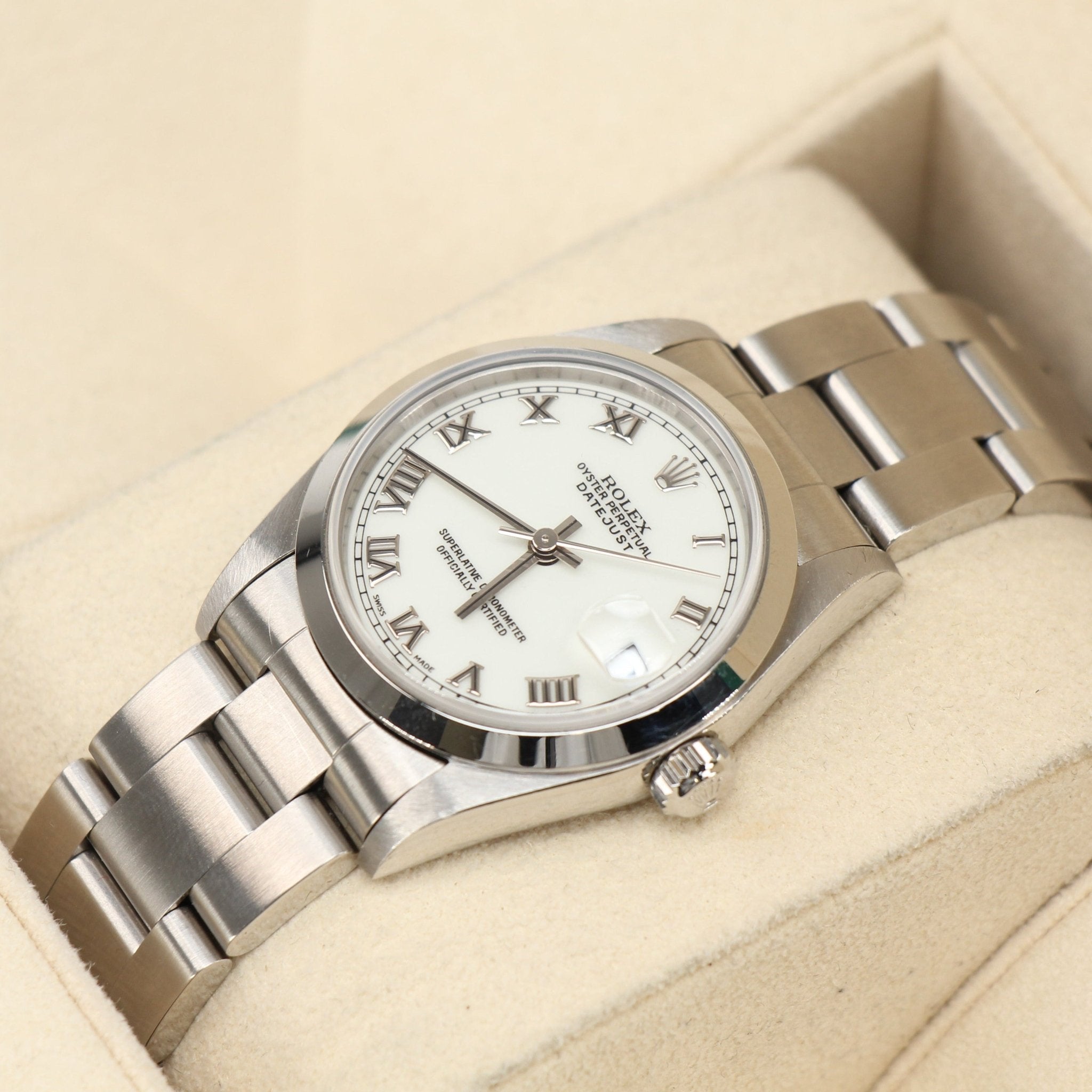 Gold & Beyond Rolex Datejust watch with a stainless steel and gold bracelet, silver dial, and date display.