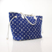 Louis Vuitton LV Match Neverfull MM handbag in beige canvas with leather trim, featuring silver hardware and side pockets.
